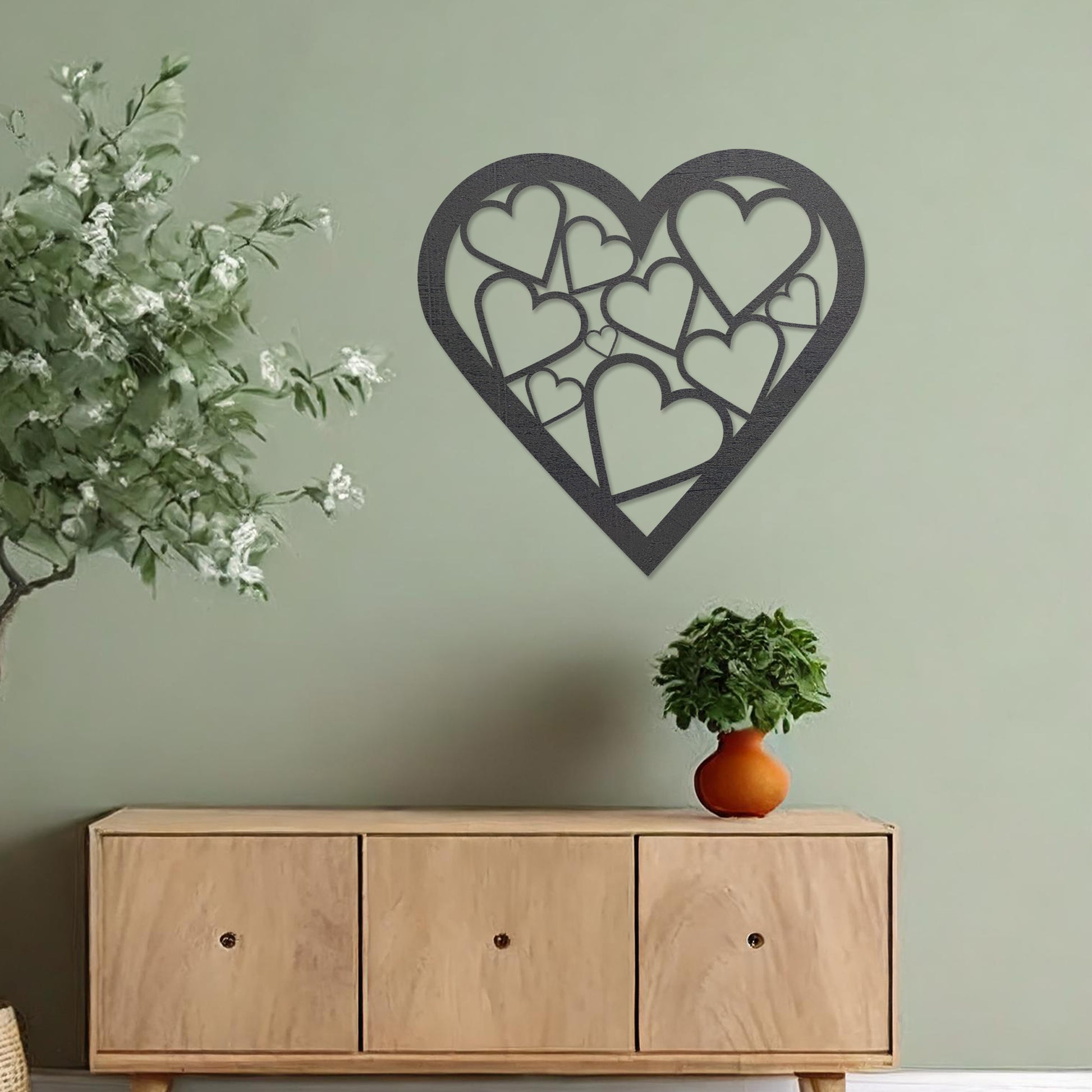 Wooden heart wall art featuring a cluster of interconnected heart shapes, placed on a neutral wall within modern room decor, highlighting its romantic and artistic design, ideal for adding charm to the space.