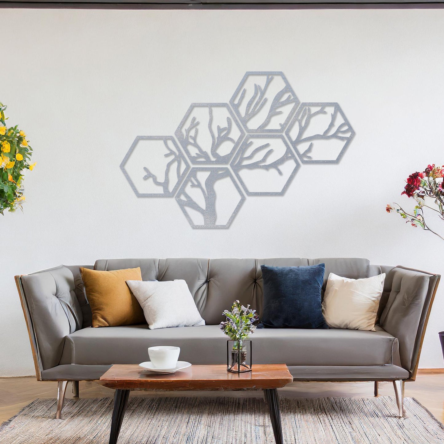 Wooden wall art showcasing a hexagonal pattern with an intricate tree branch design. Mounted on a neutral wall in a modern room decor, this geometric piece combines nature and contemporary artistry, creating a visually engaging focal point.