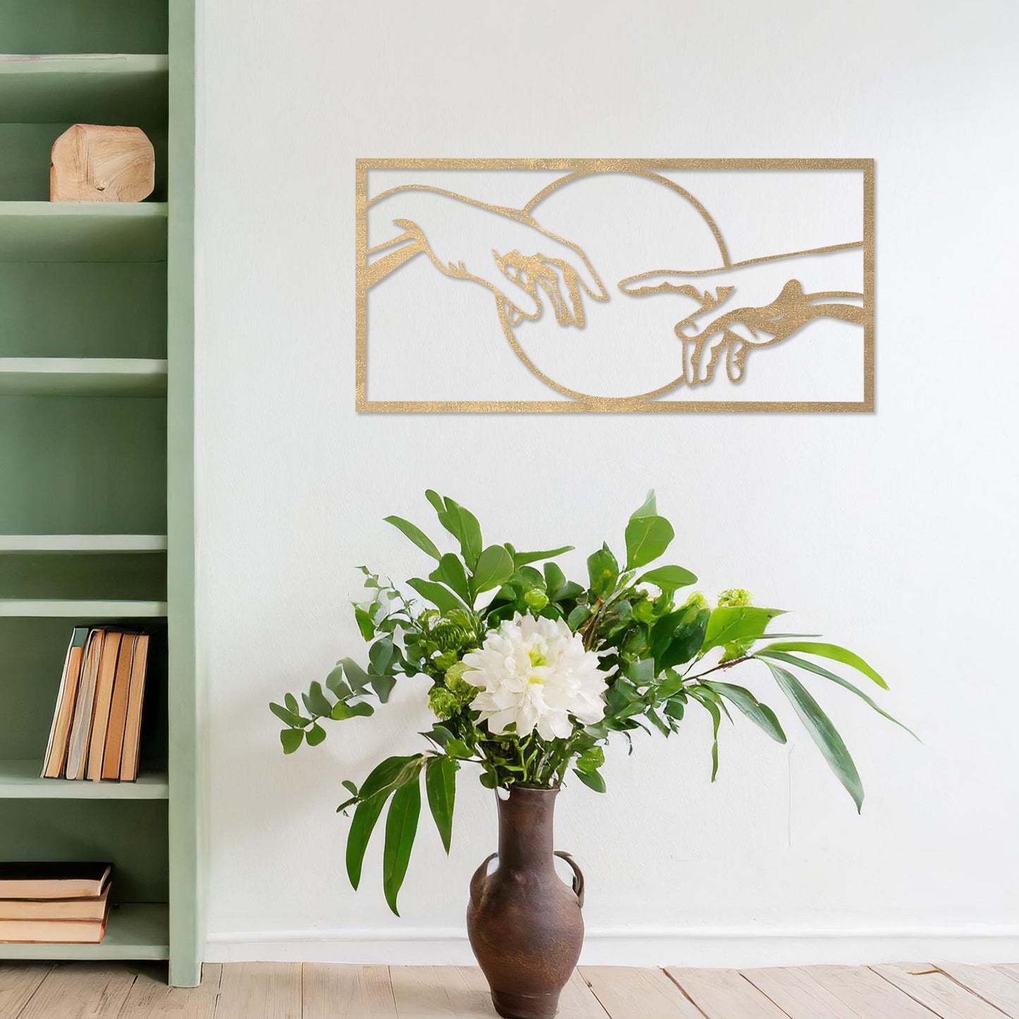 Wooden wall art featuring a minimalist depiction of two hands reaching out towards each other, framed by a circular design. Mounted on a neutral wall within modern room decor, this piece adds an artistic and meaningful touch to any space.