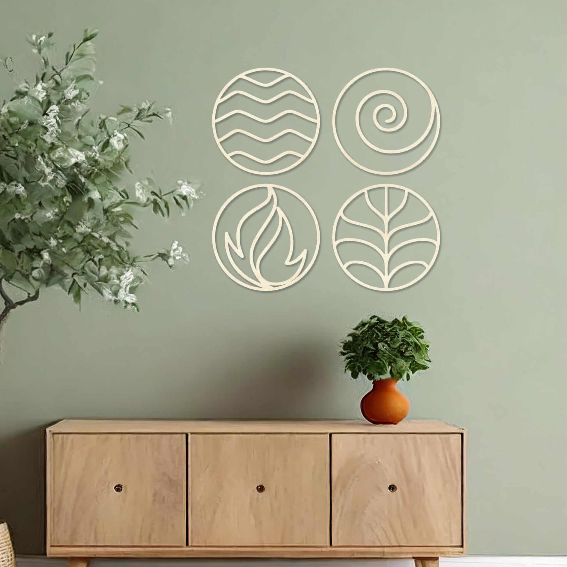 Wooden wall art set featuring four circular designs symbolising natural elements: waves for water, a spiral for air, flames for fire, and leaves for earth. Mounted on a neutral wall within modern decor, these minimalist designs evoke balance and harmony.
