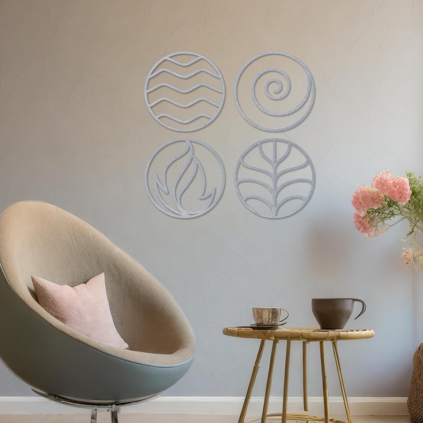 Wooden wall art set featuring four circular designs symbolising natural elements: waves for water, a spiral for air, flames for fire, and leaves for earth. Mounted on a neutral wall within modern decor, these minimalist designs evoke balance and harmony.