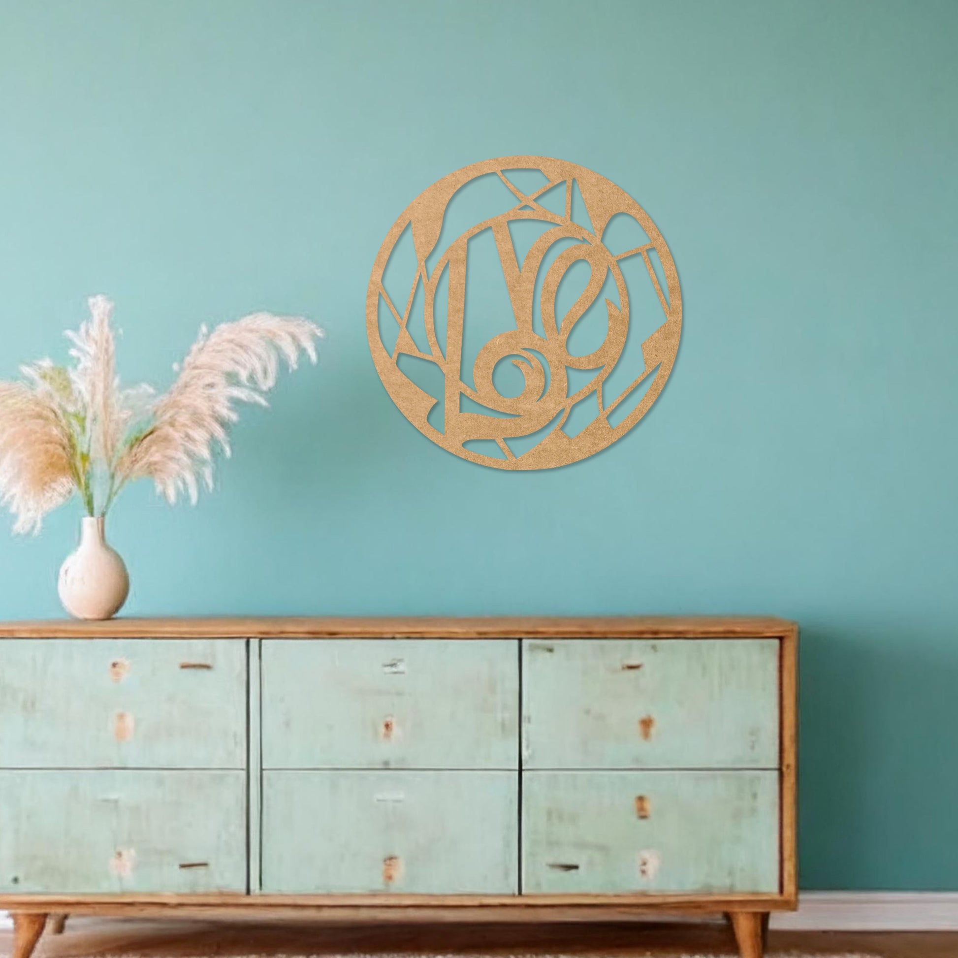 Round wooden wall art featuring an abstract geometric pattern centred around a bold, artistic swirl. Placed on a neutral wall in a modern room decor, this piece adds a touch of contemporary elegance to the setting.