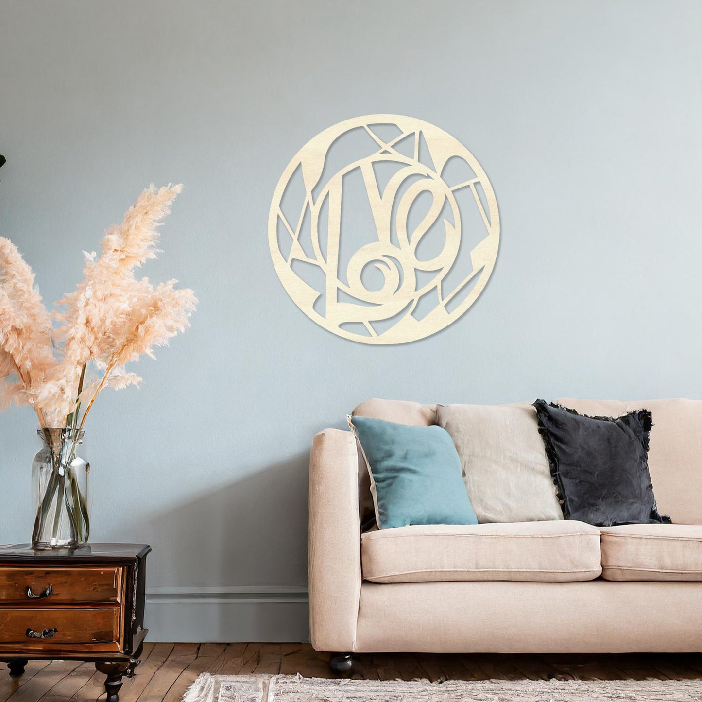 Round wooden wall art featuring an abstract geometric pattern centred around a bold, artistic swirl. Placed on a neutral wall in a modern room decor, this piece adds a touch of contemporary elegance to the setting.