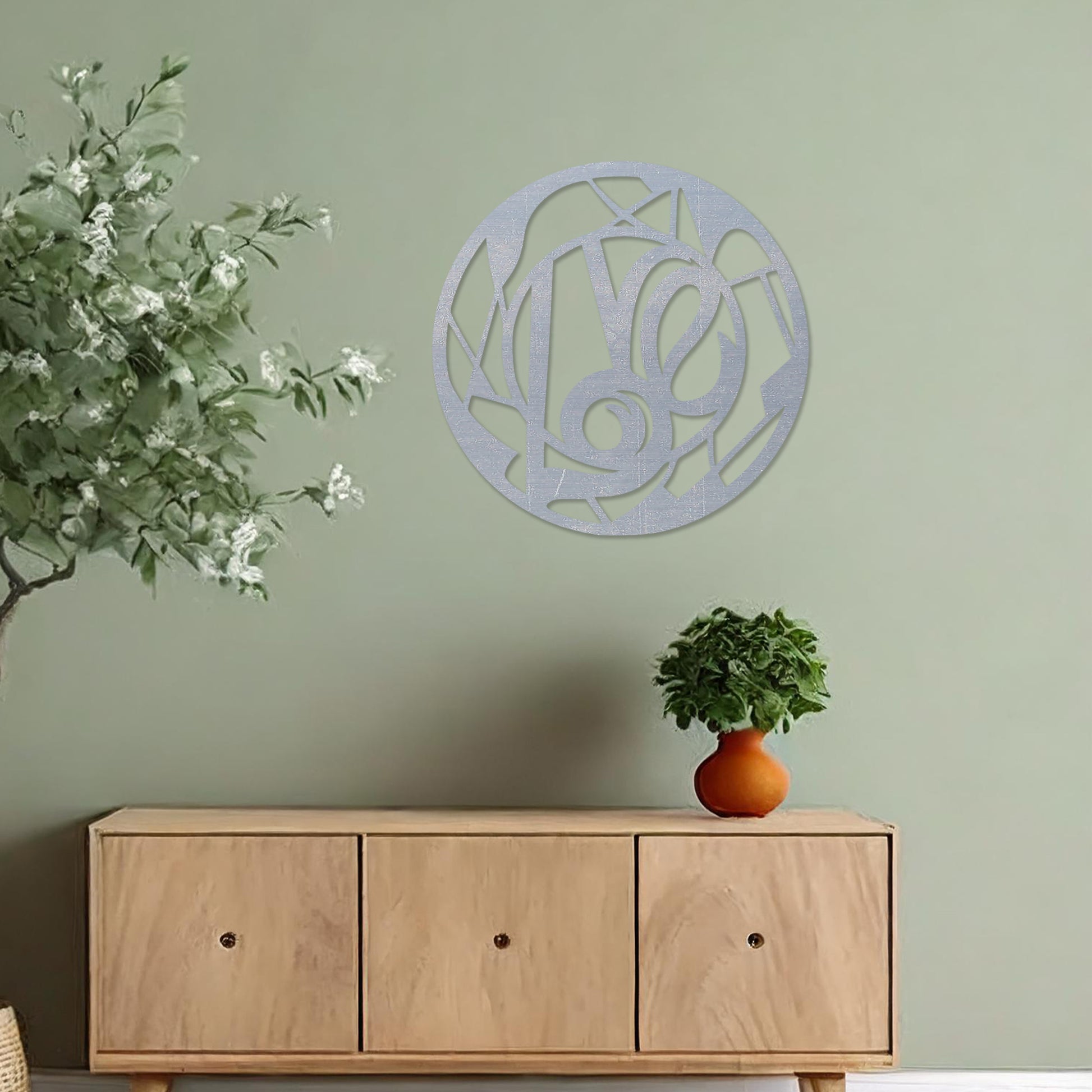 Round wooden wall art featuring an abstract geometric pattern centred around a bold, artistic swirl. Placed on a neutral wall in a modern room decor, this piece adds a touch of contemporary elegance to the setting.