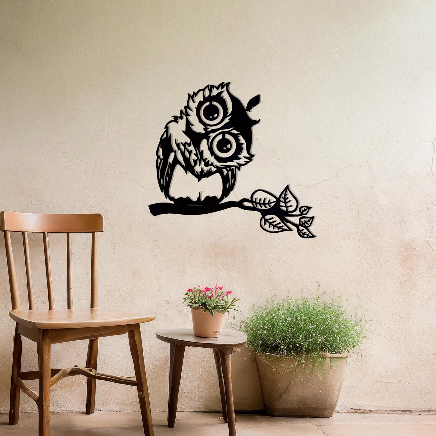 A delightful metal wall art design featuring a whimsical owl perched on a branch with intricate detailing of its feathers and expressive eyes, adding a playful and nature-inspired touch to any setting.