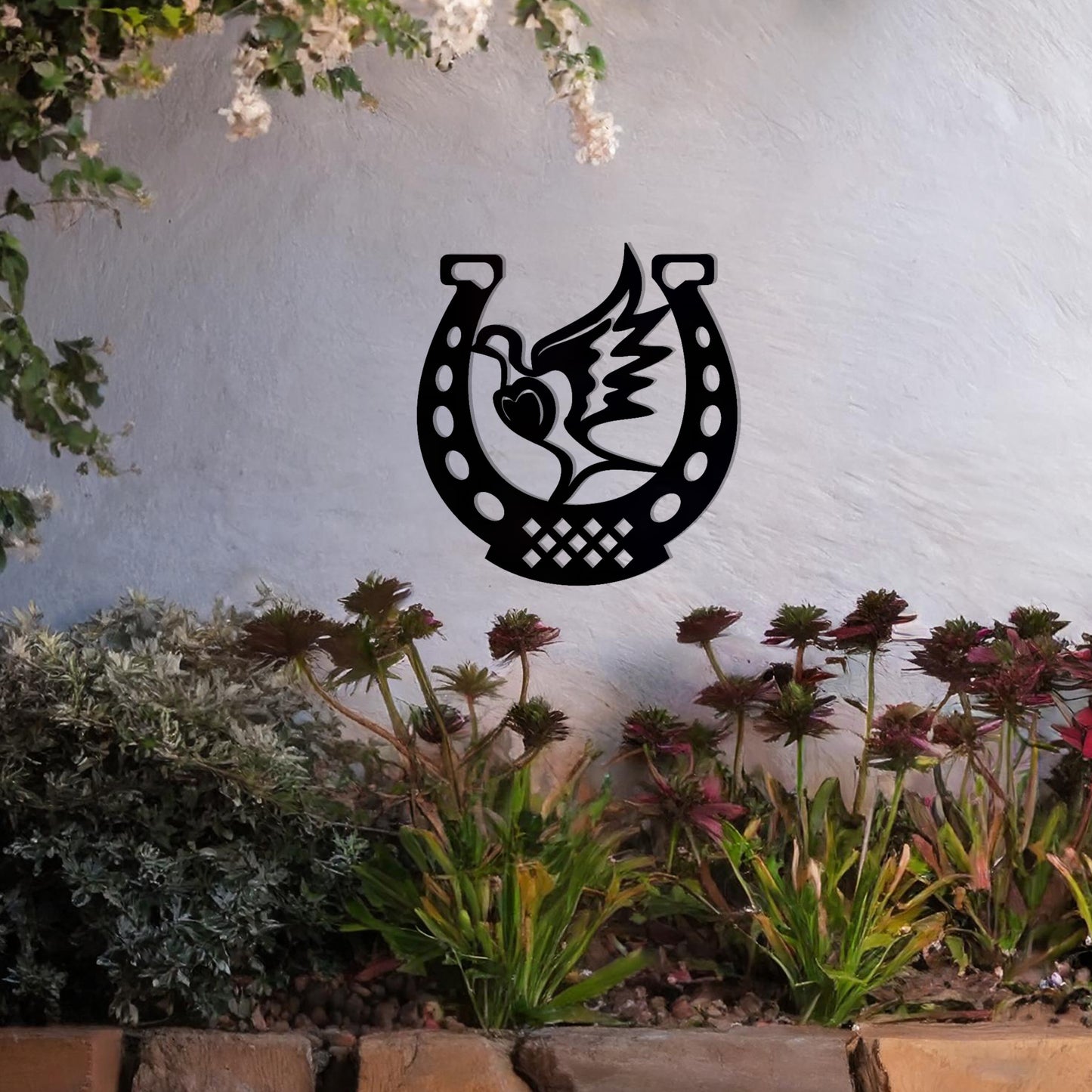 This wall art features a horseshoe design with a dove in flight carrying a heart at its center, symbolising peace and luck. A meaningful and stylish addition to any space with its intricate details and balanced composition.