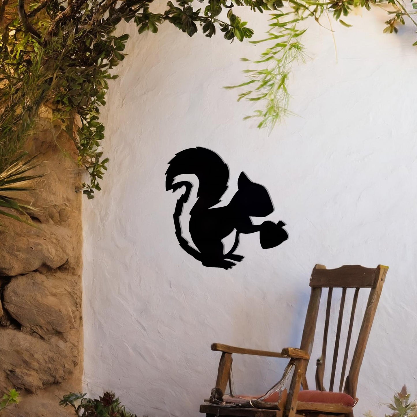 This design features a squirrel holding an acorn. The clean lines and intricate details of the animal's silhouette capture its playful and curious nature.