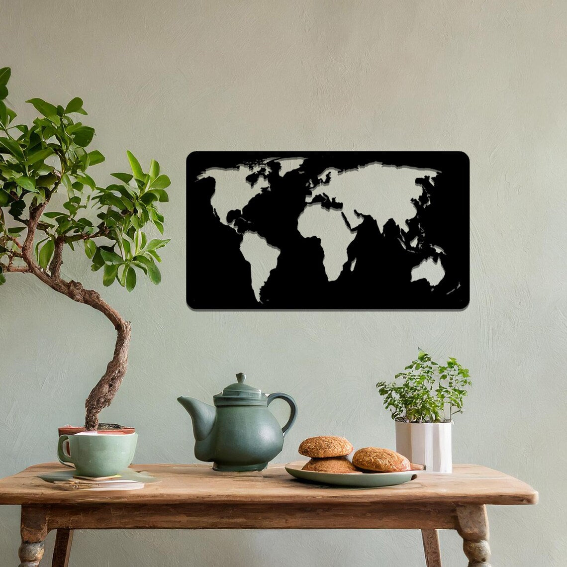 Metal wall art featuring a rectangular world map design with precise continent outlines, serving as a stylish and sophisticated addition to the space.
