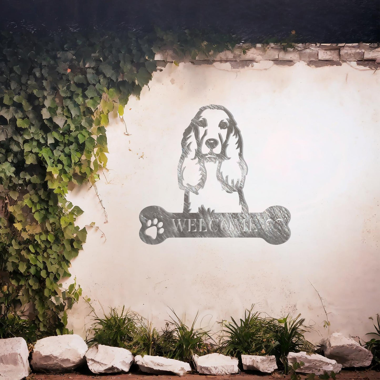 Metal Cocker Spaniel dog design with a bone-shaped 'WELCOME' text and paw prints, perfect for adding a friendly and welcoming touch to entryways or outdoor spaces.