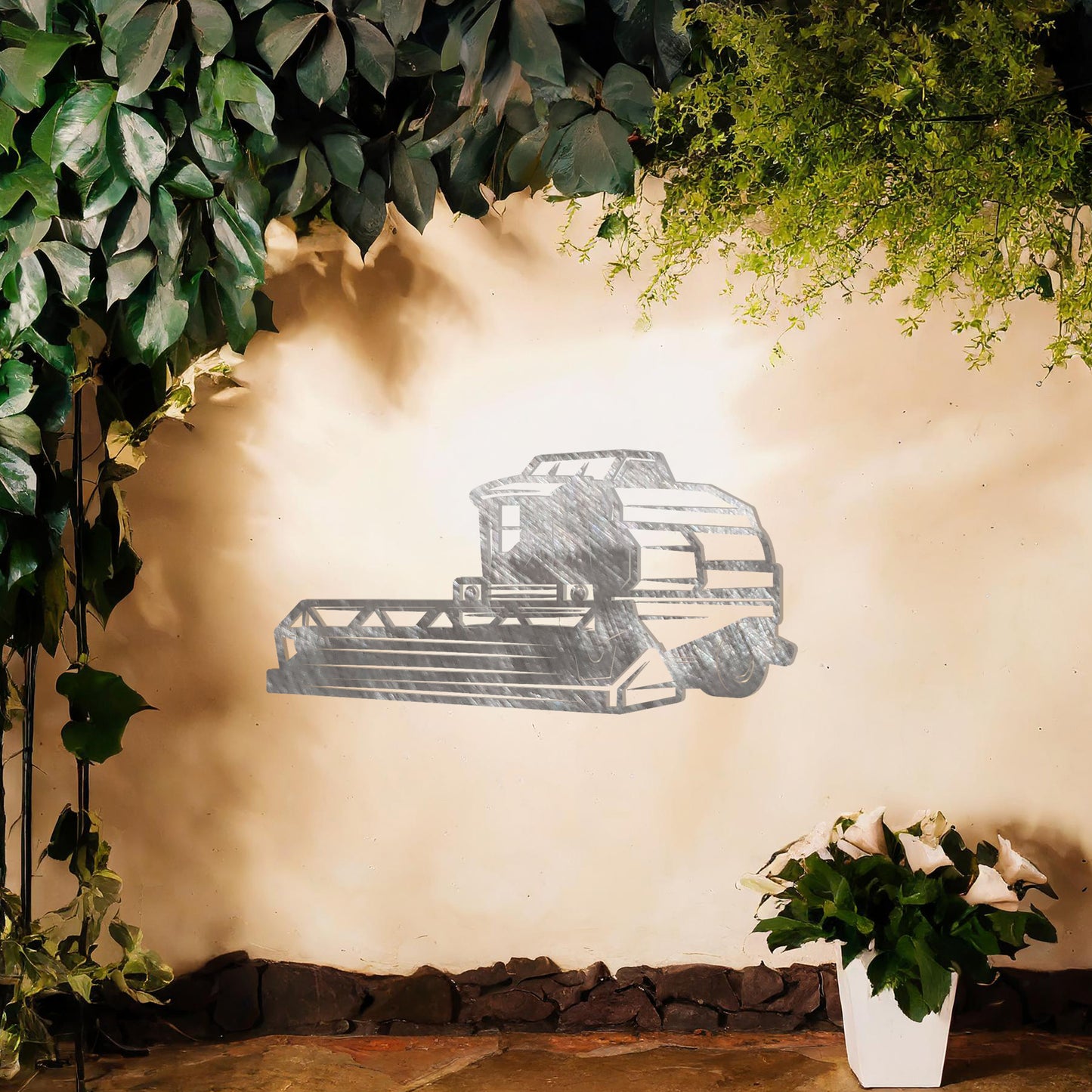Metal wall art featuring a detailed illustration of a combine harvester, designed with bold lines and geometric shapes, ideal for those passionate about farming or agriculture.