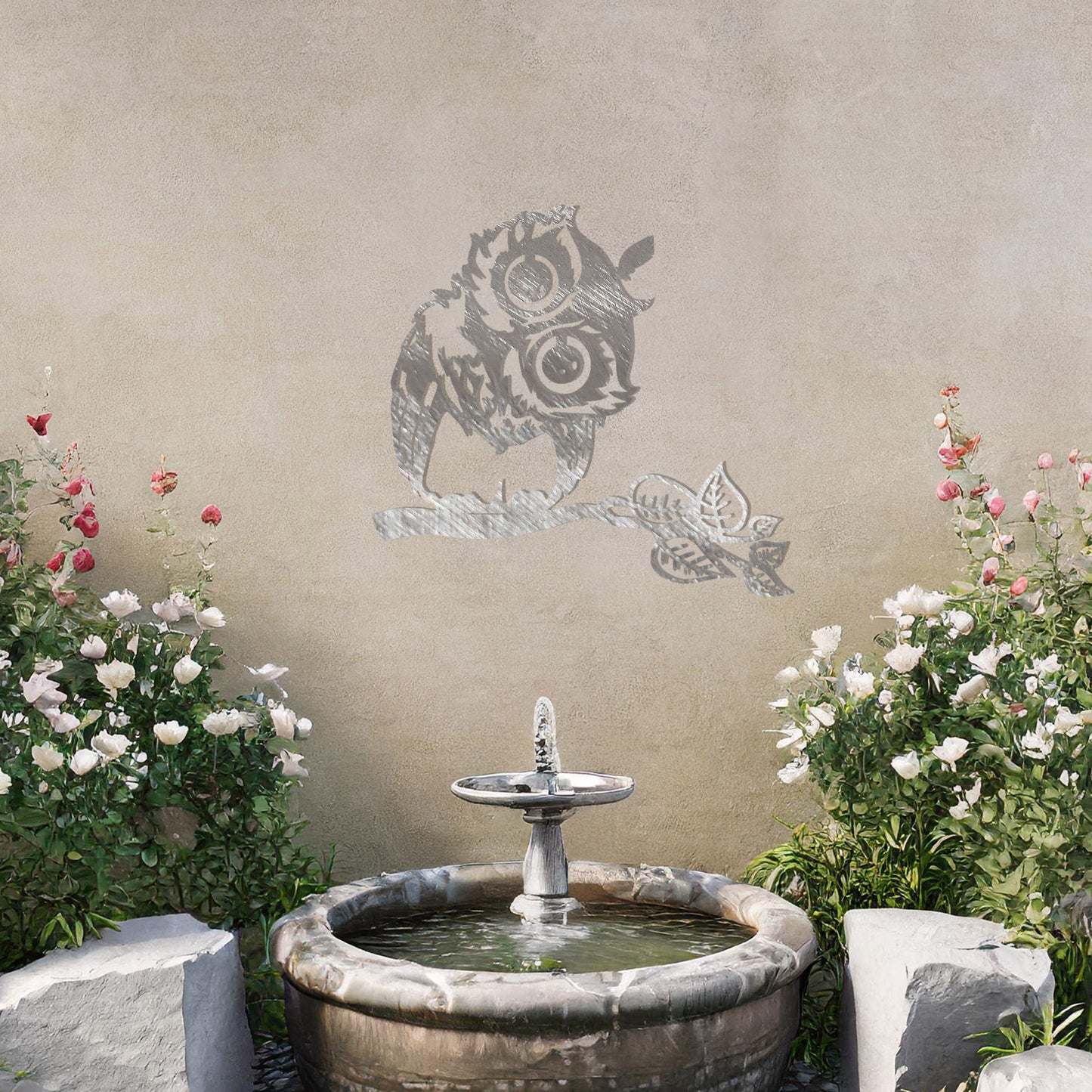 A delightful metal wall art design featuring a whimsical owl perched on a branch with intricate detailing of its feathers and expressive eyes, adding a playful and nature-inspired touch to any setting.