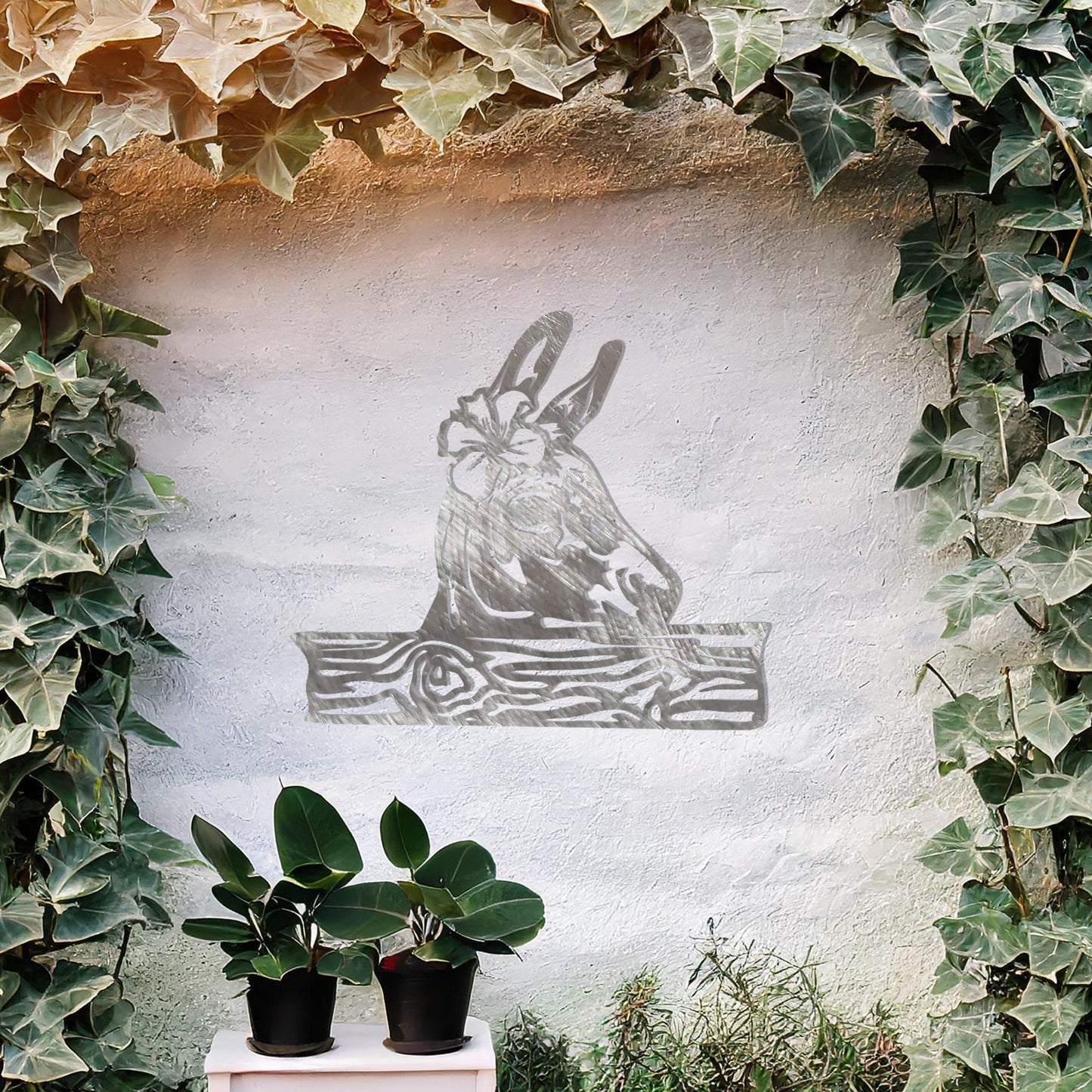 This wall art design showcases a beautifully detailed donkey head adorned with a flower, resting atop a wooden plank-like base. A charming and rustic piece perfect for farmhouse decor or animal enthusiasts.