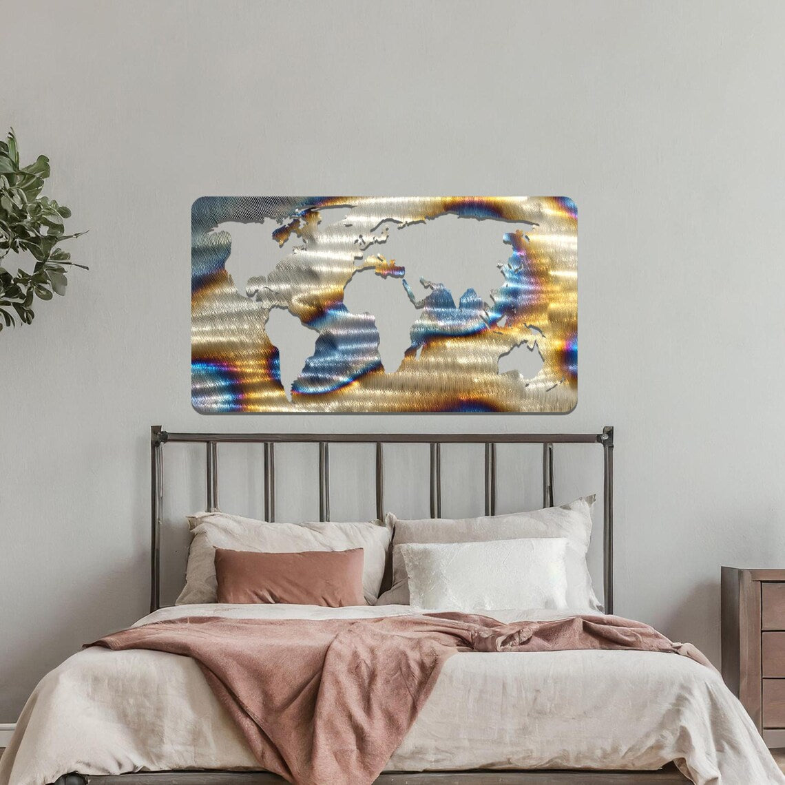 Metal wall art featuring a rectangular world map design with precise continent outlines, serving as a stylish and sophisticated addition to the space.