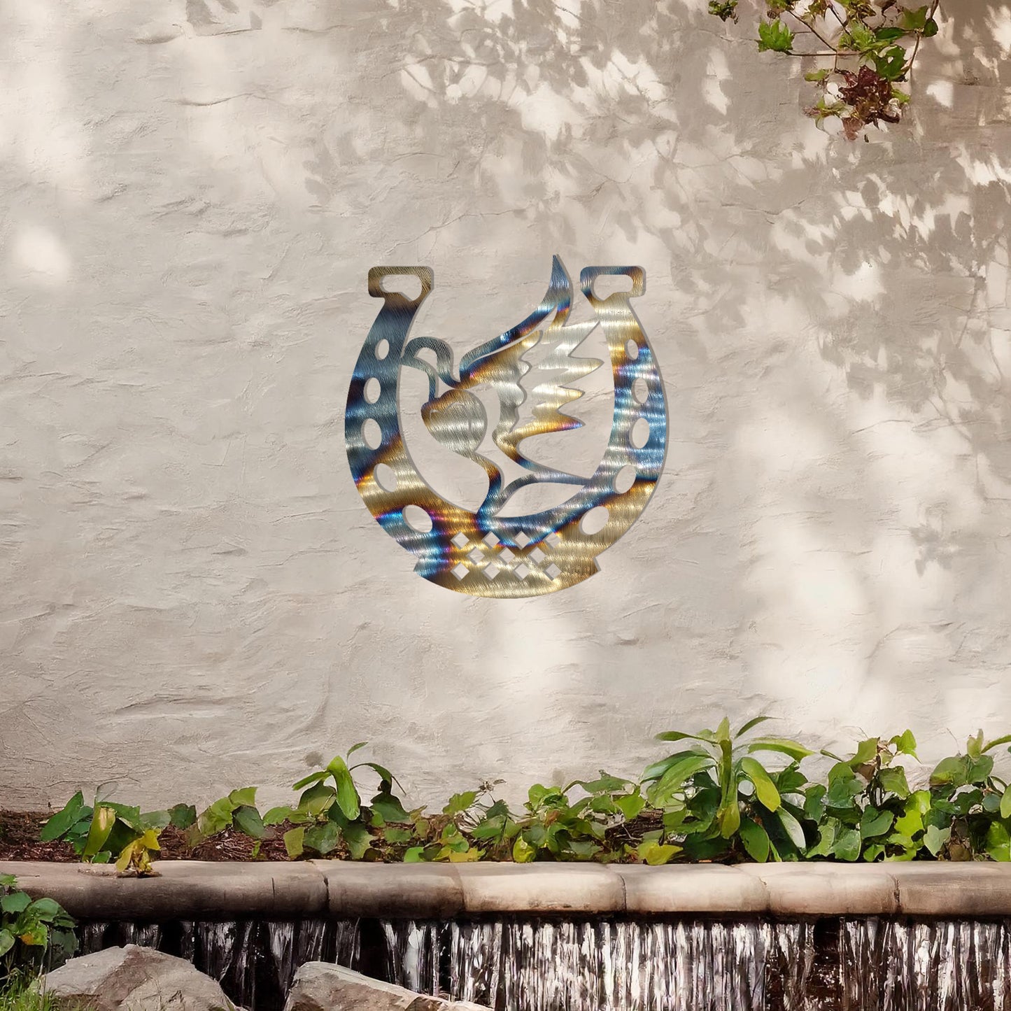 This wall art features a horseshoe design with a dove in flight carrying a heart at its center, symbolising peace and luck. A meaningful and stylish addition to any space with its intricate details and balanced composition.