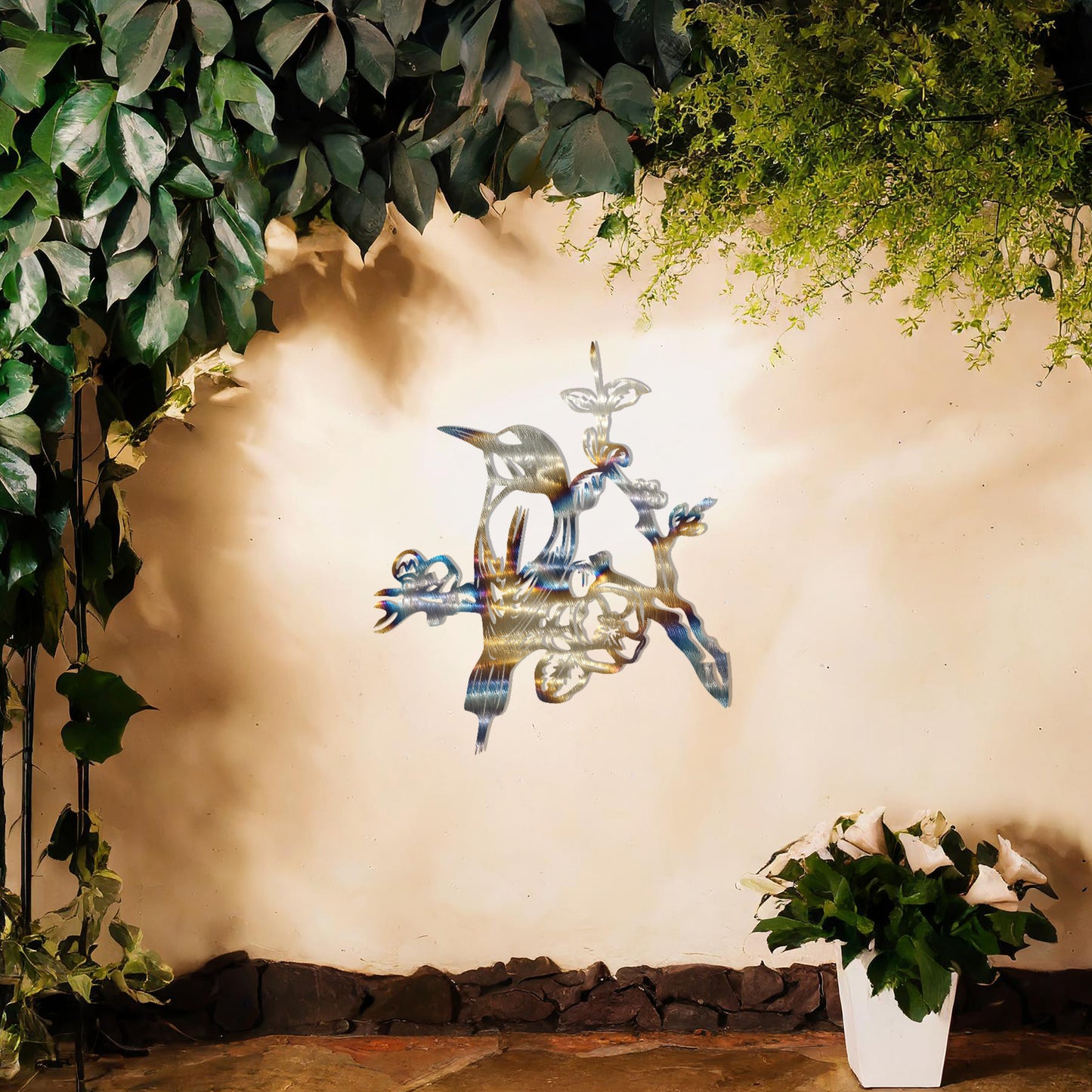 This design showcases a perched bird surrounded by detailed blossoms and branches. The intricate artistry highlights the bird's delicate features and the natural elegance of the flowers, making it a beautiful addition to any nature-inspired space.