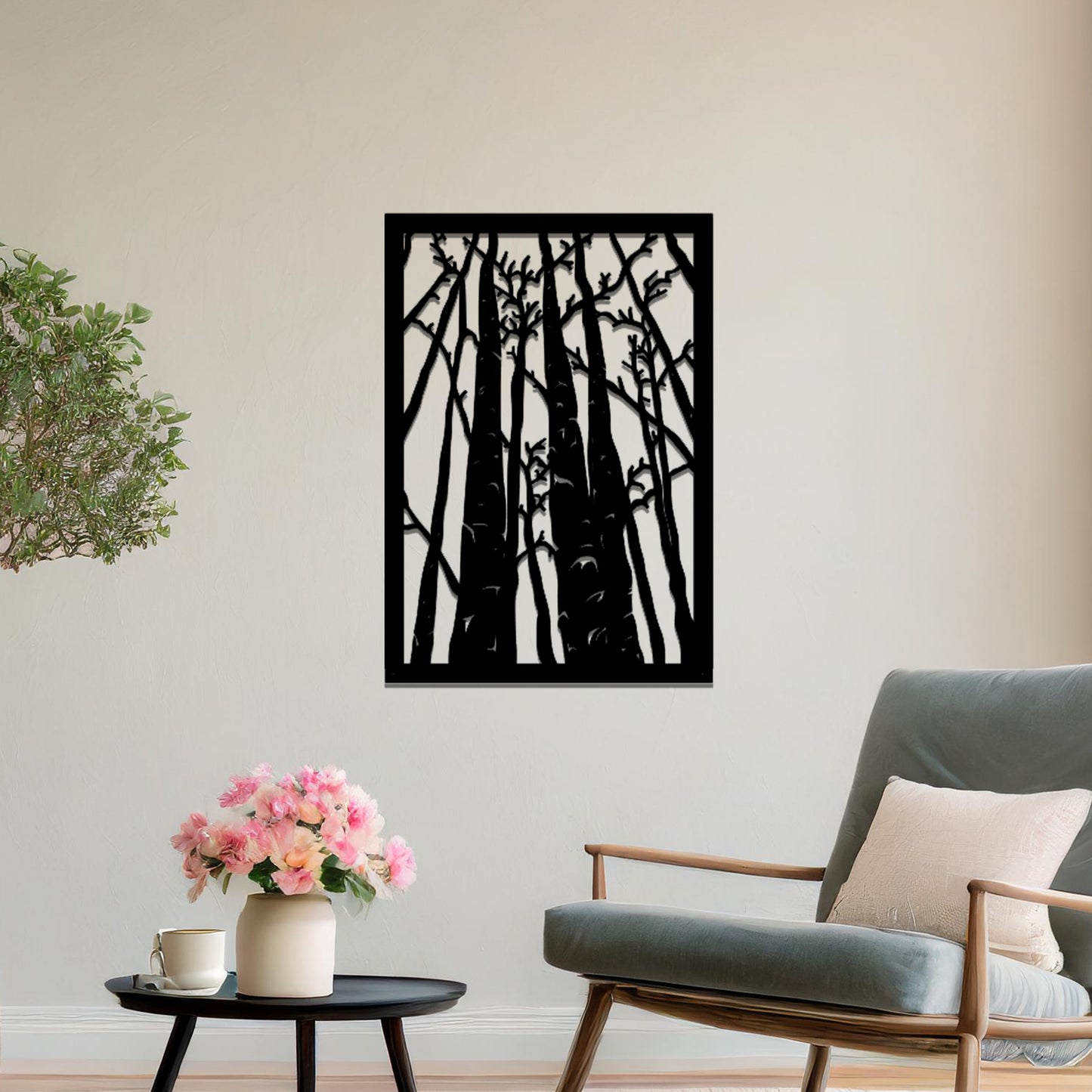 Metal wall art featuring a rectangular design of tall trees with bare branches, showcasing intricate details, displayed on a neutral wall within modern decor.