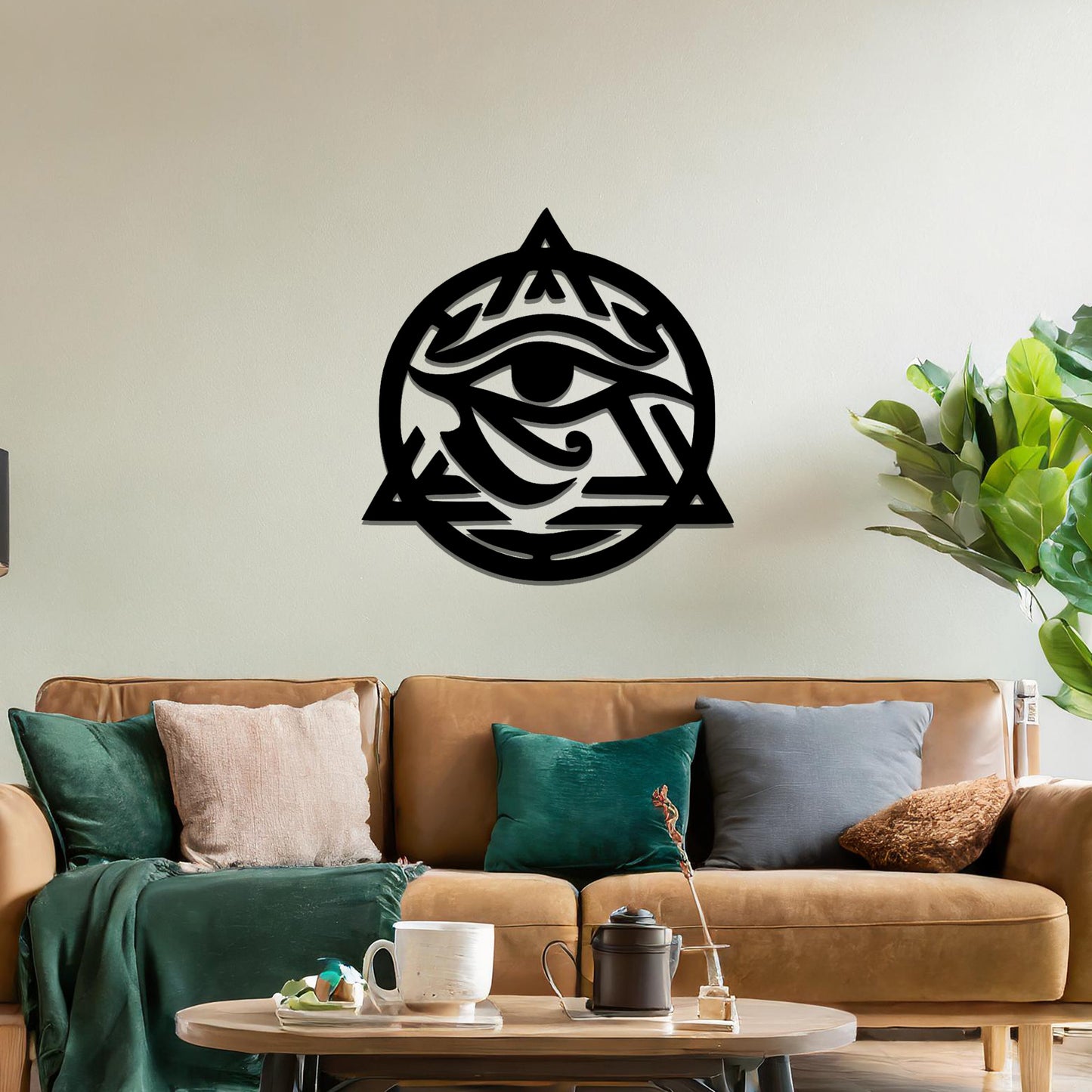 Metal wall art featuring an intricate design of the Eye of Horus, enclosed within a geometric triangle and circle. The artwork is placed on a neutral wall in a modern living room setting, adding to the contemporary decor.