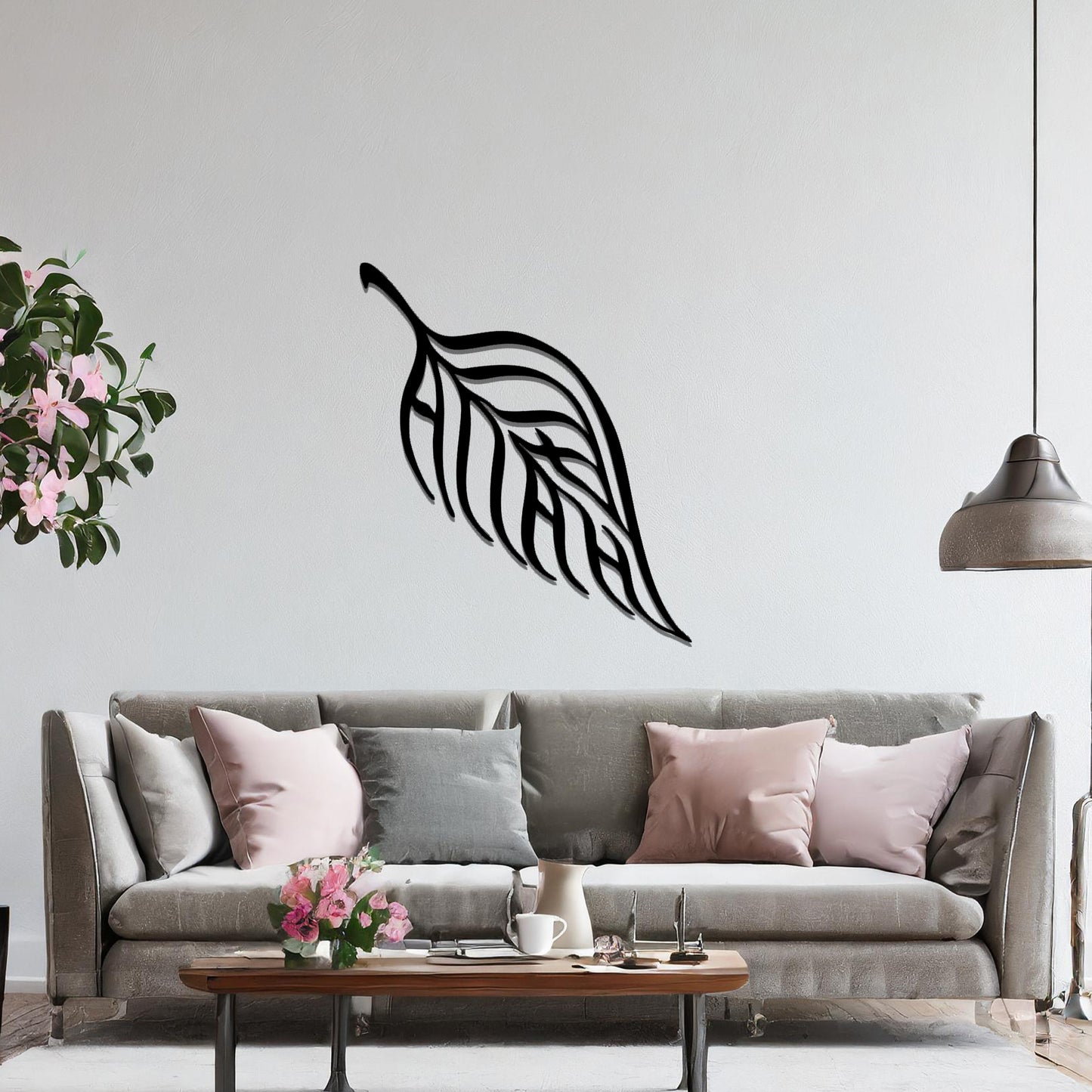 Metal wall art featuring a stylised leaf design with intricate linework and the word "Allah" seamlessly incorporated, mounted on a neutral wall within modern room decor. The elegant craftsmanship and spiritual motif make it a striking focal point in the space.