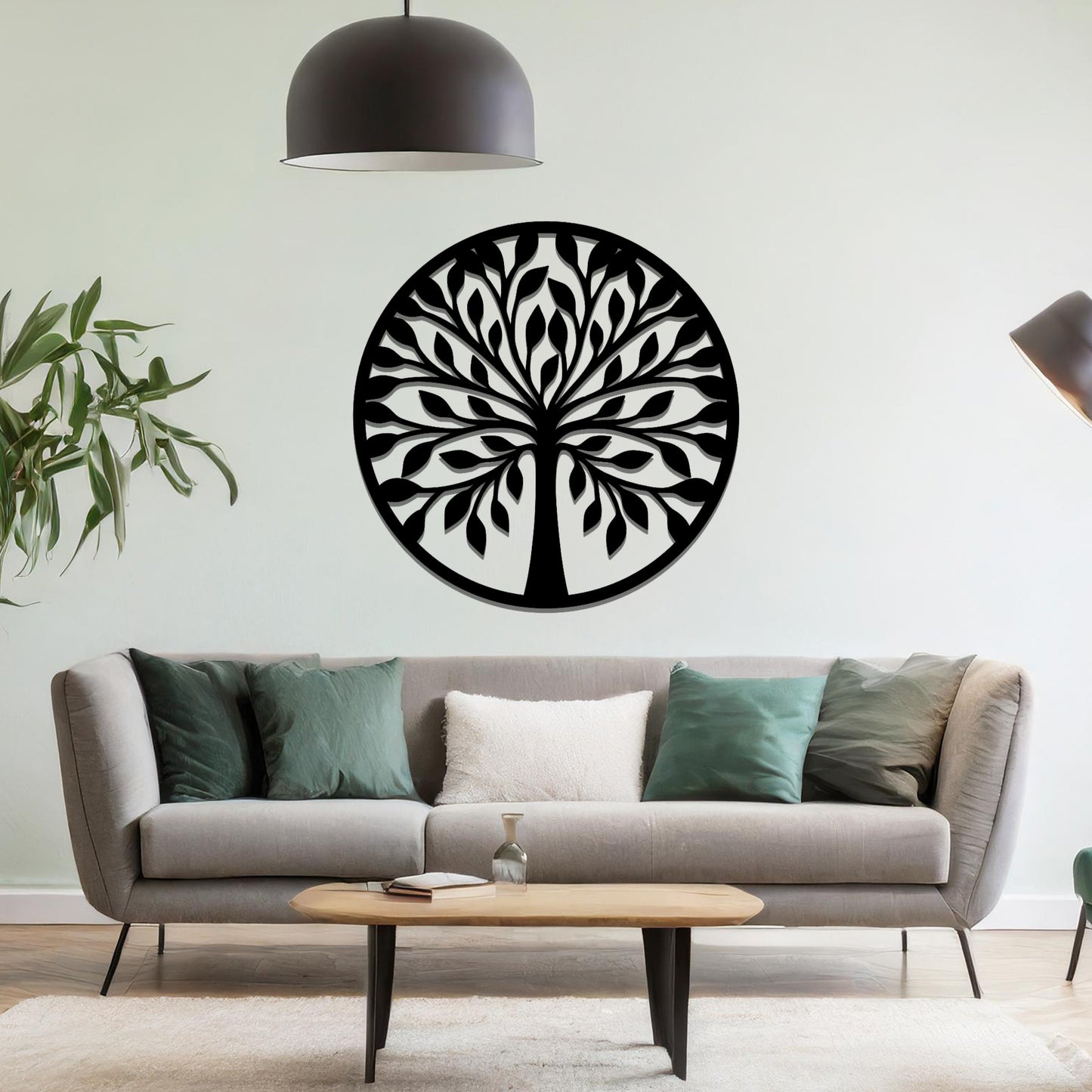 Metal wall art featuring a circular tree design with symmetrical branches and leaves, creating a balanced and nature-inspired focal point for the room.