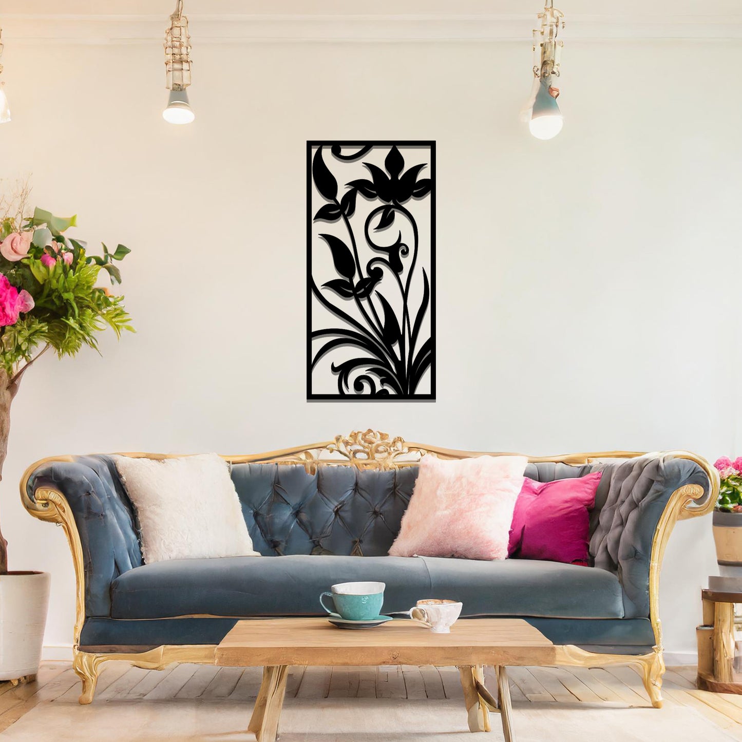 Metal wall art featuring a vertical design with elegant floral motifs and intricate swirling patterns, mounted on a neutral wall within sophisticated room decor. The delicate floral silhouette adds a refined and artistic touch to the space.