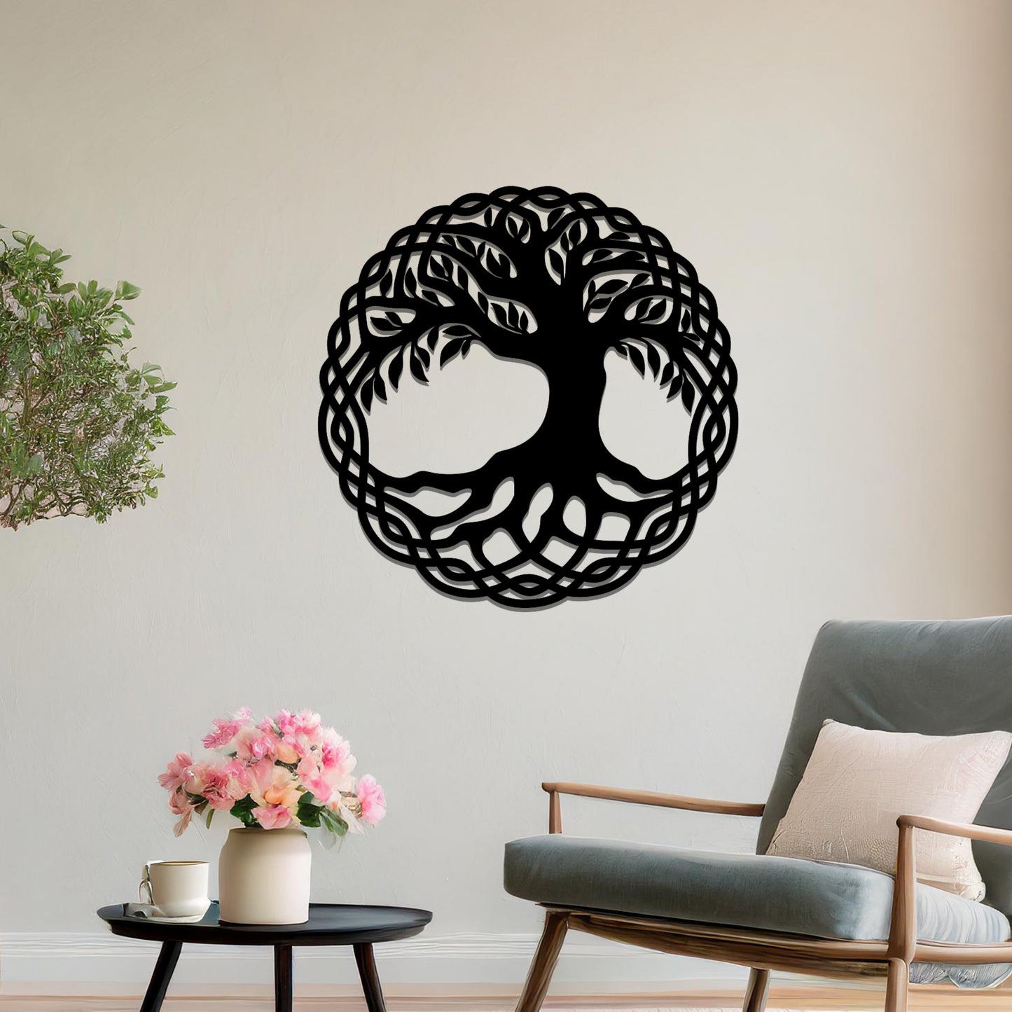 Metal wall art featuring a circular tree of life design with intricate roots and branches enclosed in a detailed border, crafted with precise laser-cut techniques, displayed on a neutral wall within modern decor.