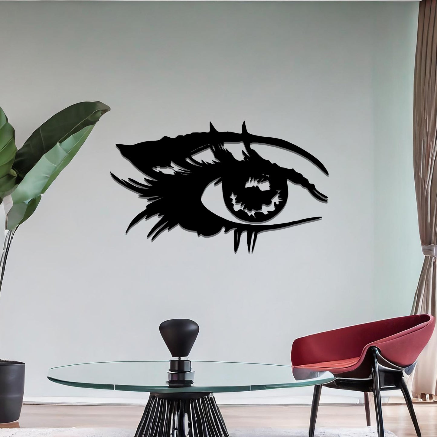 Striking metal wall art featuring a bold and artistic eye design with intricate detailing, mounted on a neutral wall within modern room decor. The focus is entirely on the creative and contemporary craftsmanship of the wall art, enhancing the space's aesthetic appeal.