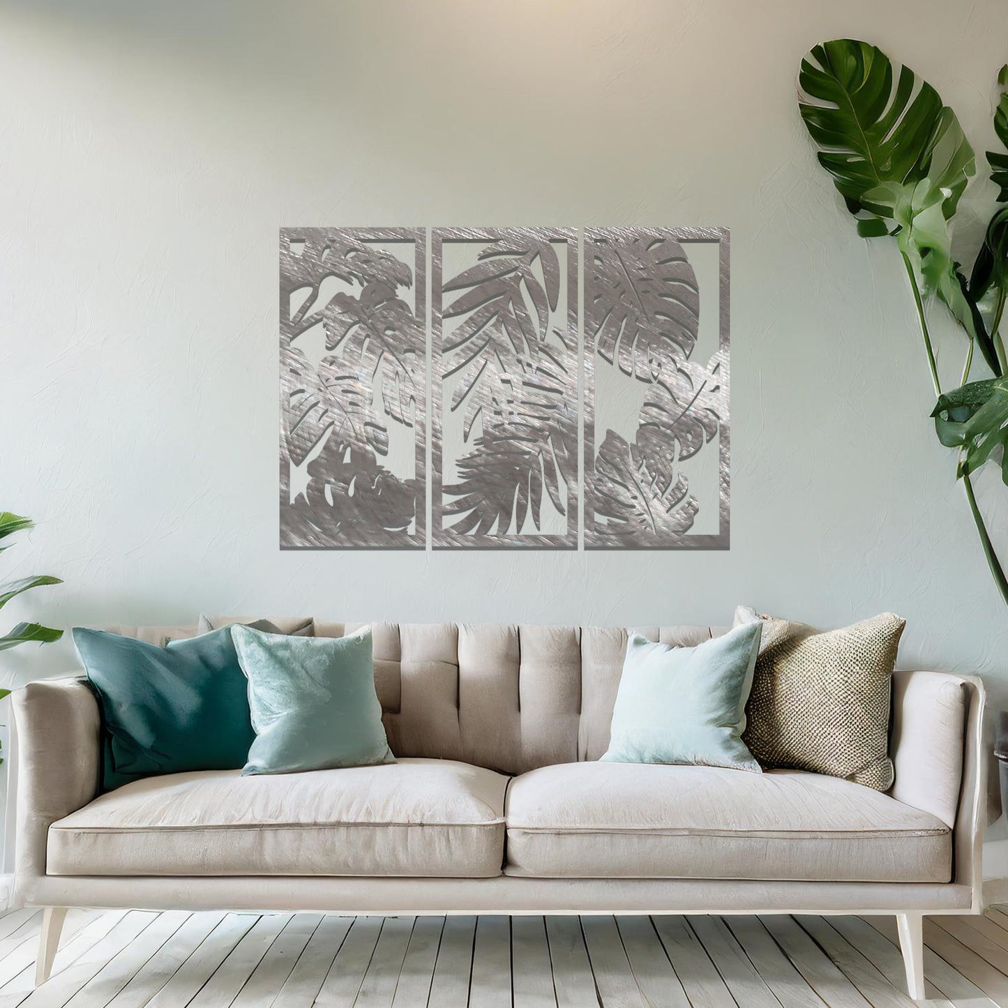 A tropical wall art set featuring a trio of panels adorned with intricate monstera and palm leaf patterns. Perfect for bringing a lush, botanical vibe to your indoor spaces.