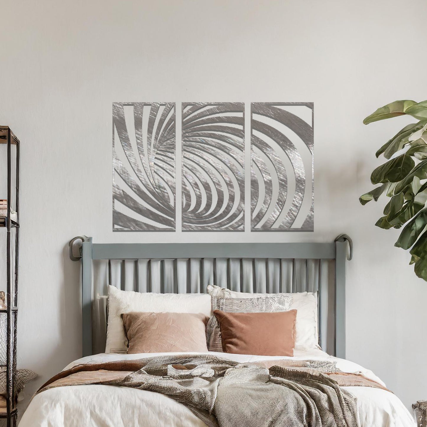 Metal wall art featuring a three-panel design with swirling, spiral-inspired patterns, crafted with precise laser-cut detailing, displayed on a neutral wall within modern decor.