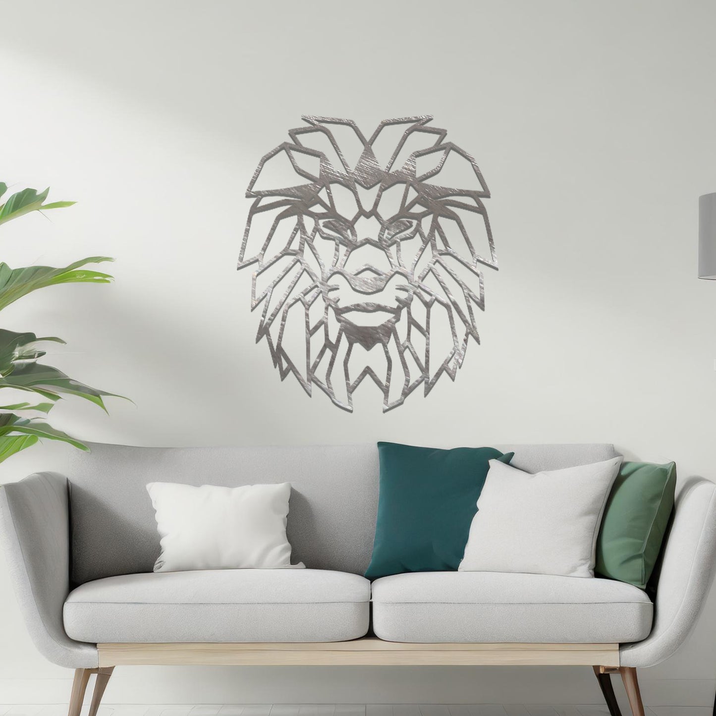 Metal wall art featuring a geometric lion head design with intricate angular detailing, crafted with precise laser-cut techniques, displayed on a neutral wall within modern decor.
