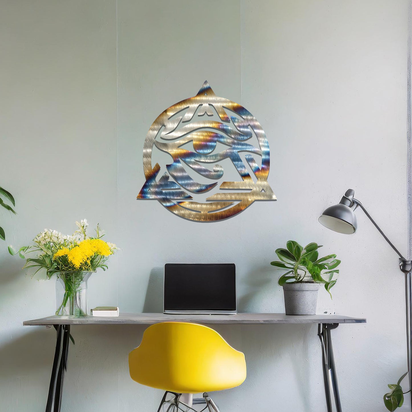 Metal wall art featuring an intricate design of the Eye of Horus, enclosed within a geometric triangle and circle. The artwork is placed on a neutral wall in a modern living room setting, adding to the contemporary decor.