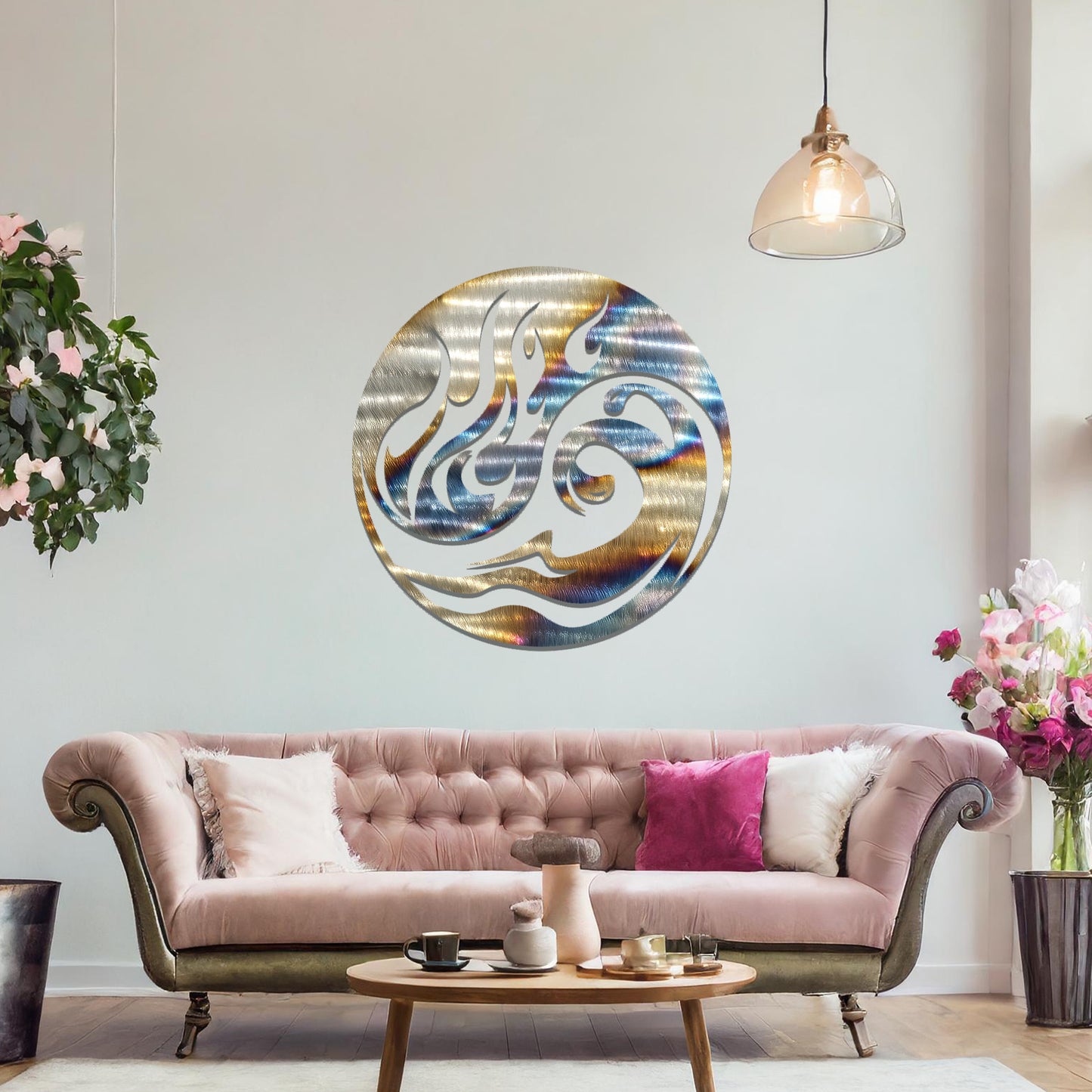 Metal wall art featuring a circular design with a dynamic swirl of flames and waves, mounted on a neutral wall within modern decor. The fluid lines and bold elements create a striking and energetic focal point for the room.