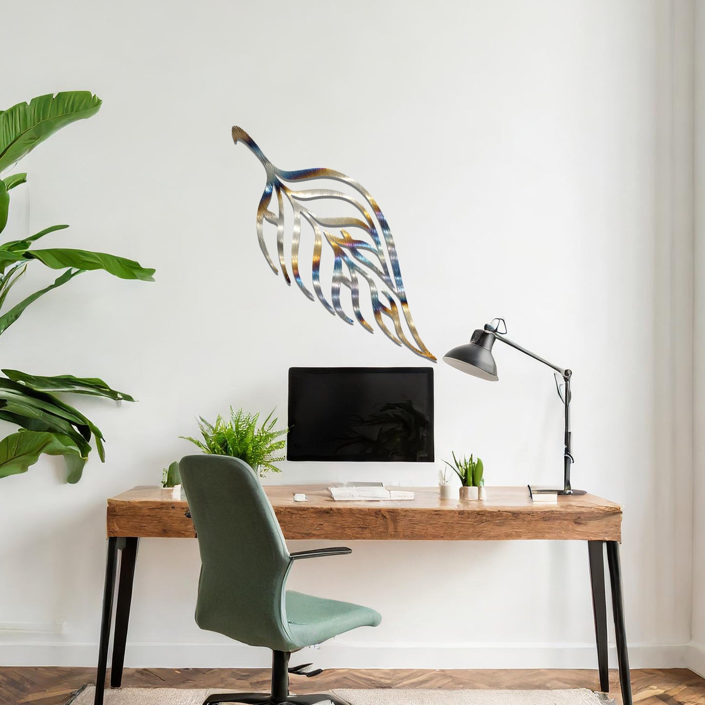 Metal wall art featuring a stylised leaf design with intricate linework and the word "Allah" seamlessly incorporated, mounted on a neutral wall within modern room decor. The elegant craftsmanship and spiritual motif make it a striking focal point in the space.