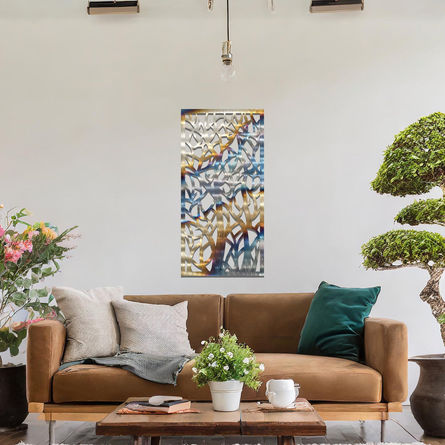 Metal wall art featuring a rectangular design with intricate tree branches and abstract shapes, creating a visually captivating and artistic focal point for the room.