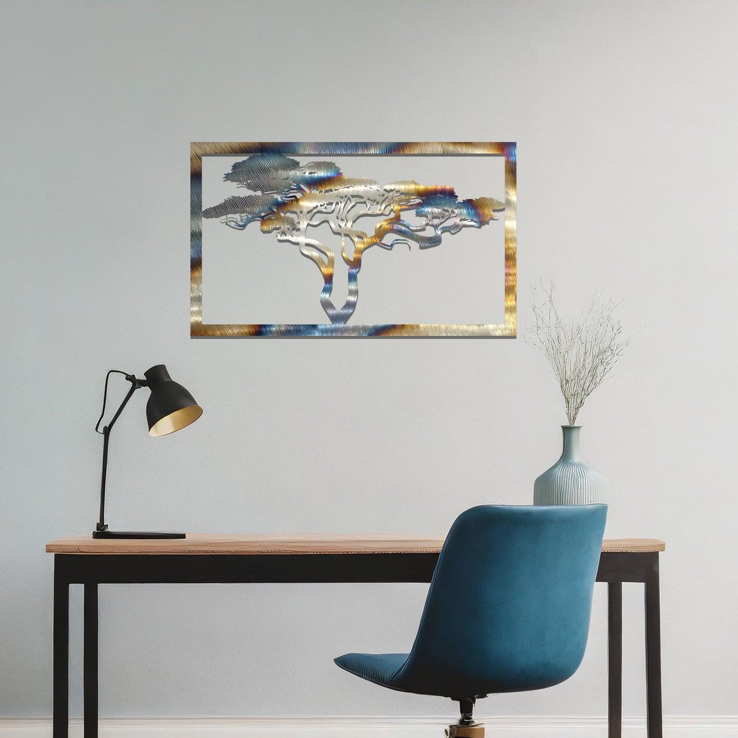 Metal wall art featuring a rectangular design with a silhouette of an African tree, showcasing intricate branch details, mounted on a neutral wall within modern office decor. The elegant craftsmanship adds a natural and sophisticated touch to the contemporary workspace.