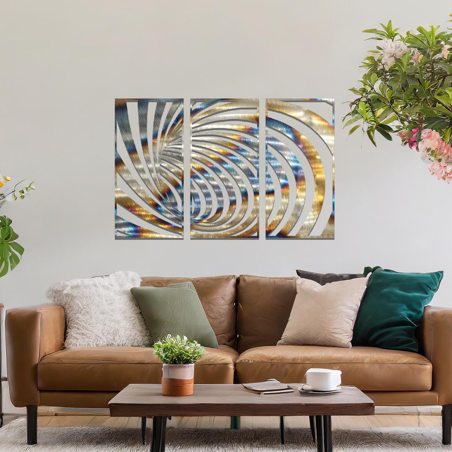 Metal wall art featuring a three-panel design with swirling, spiral-inspired patterns, crafted with precise laser-cut detailing, displayed on a neutral wall within modern decor.