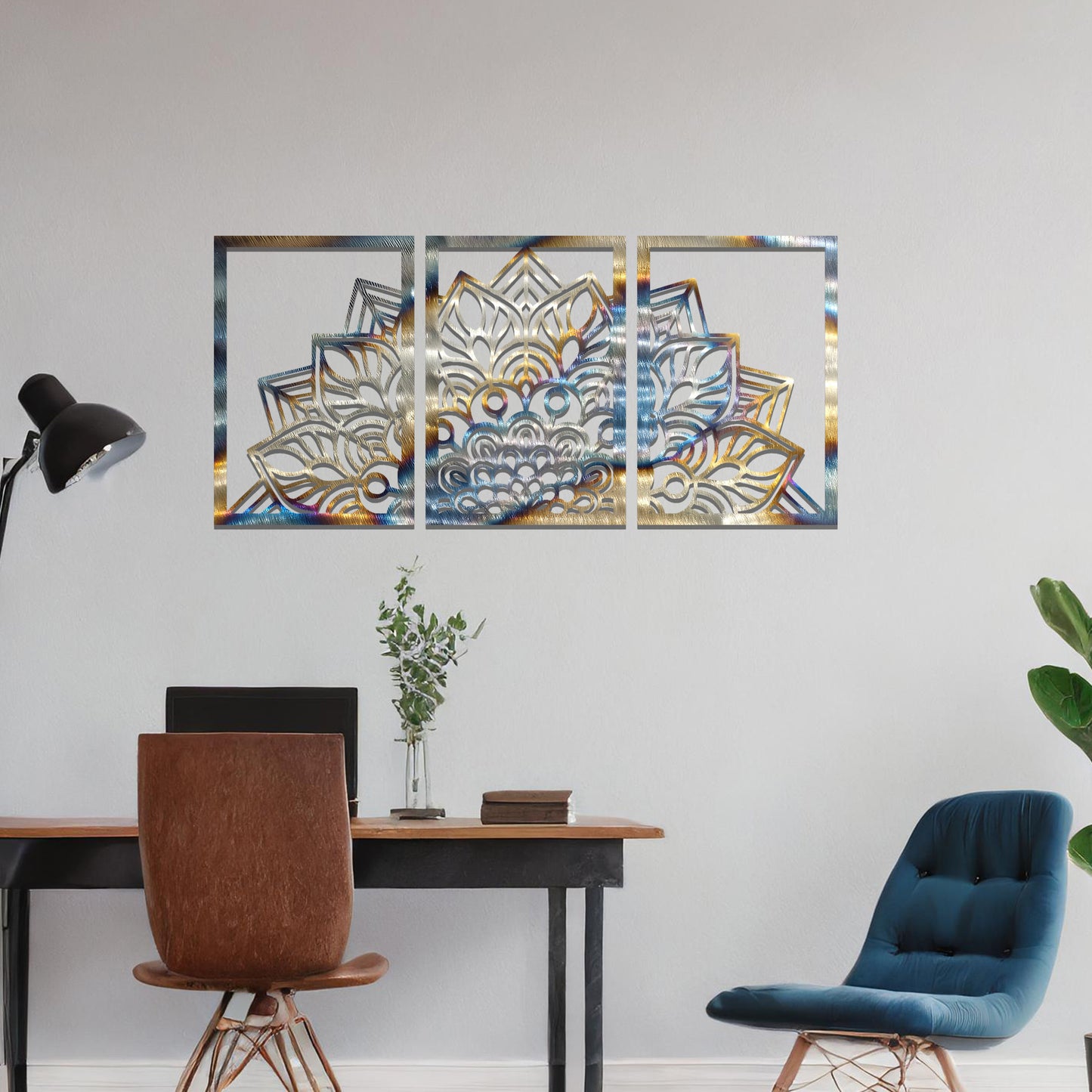 A metal wall art design featuring a detailed mandala pattern, divided into three panels. The intricate floral design is framed within each section. The art is displayed on a neutral wall in a modern bedroom, adding elegance to the peaceful setting.