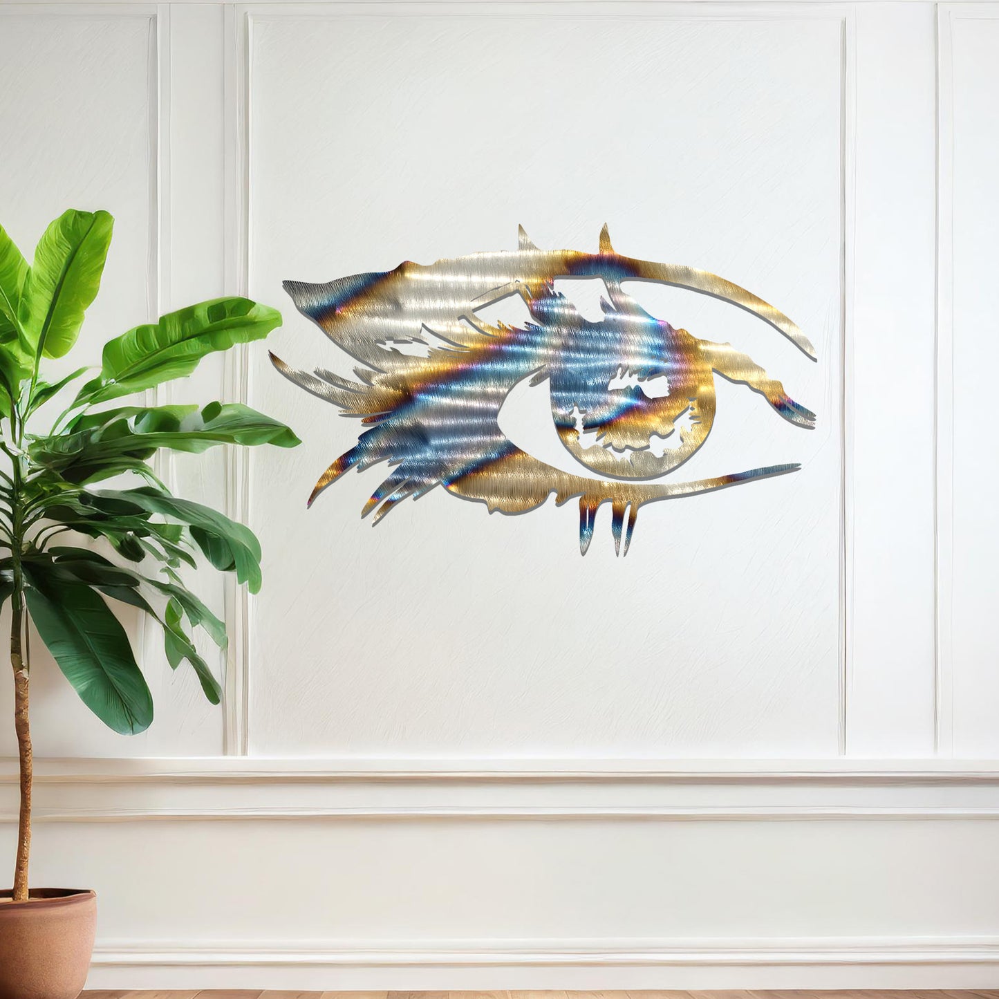 Striking metal wall art featuring a bold and artistic eye design with intricate detailing, mounted on a neutral wall within modern room decor. The focus is entirely on the creative and contemporary craftsmanship of the wall art, enhancing the space's aesthetic appeal.