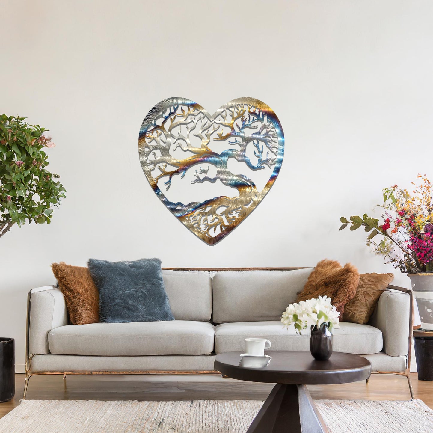 Metal wall art featuring a heart-shaped design with a detailed tree and intricate branching pattern, creating a striking and artistic focal point for the room.