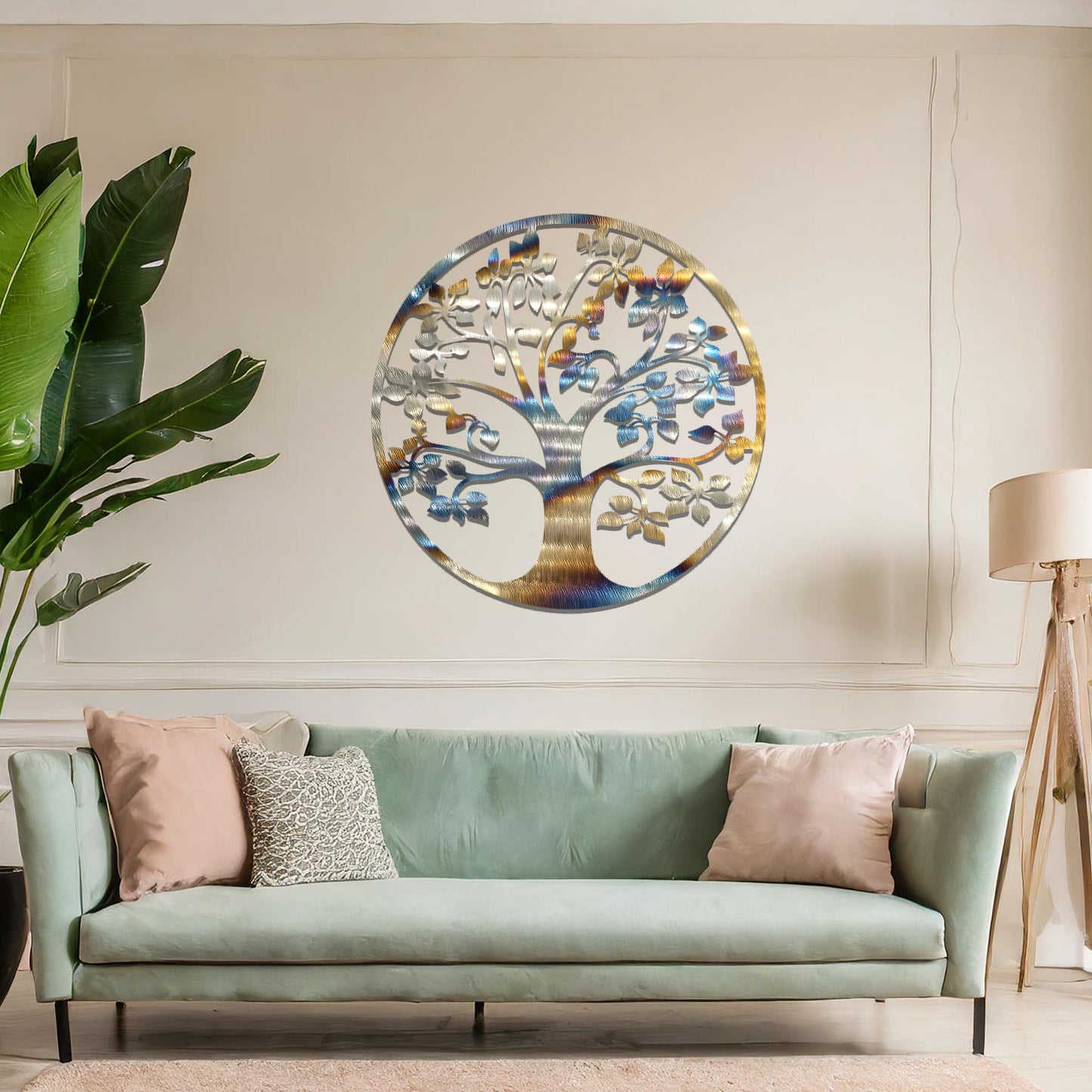 Metal wall art featuring a circular tree design with a detailed trunk, branches, and leaves, crafted with precise laser-cut techniques, displayed on a neutral wall within modern decor.