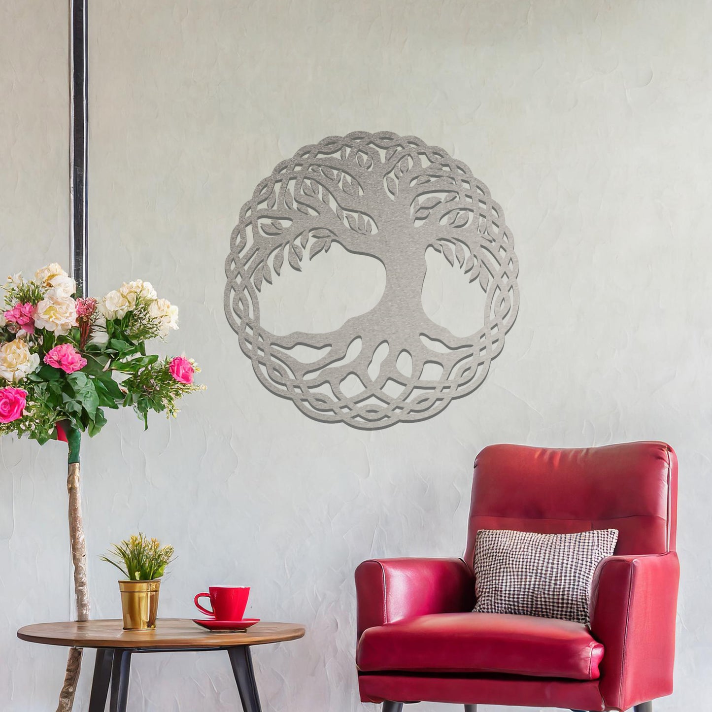 Metal wall art featuring a circular tree of life design with intricate roots and branches enclosed in a detailed border, crafted with precise laser-cut techniques, displayed on a neutral wall within modern decor.