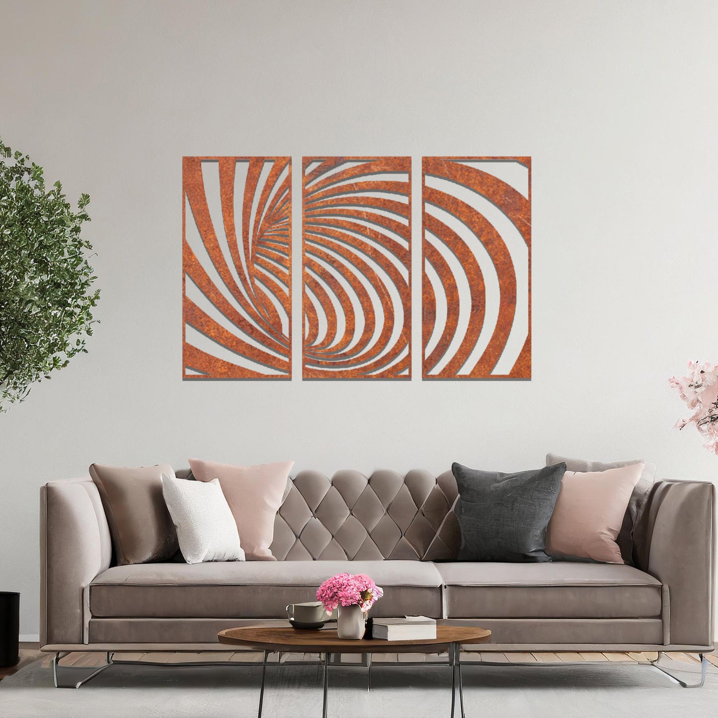 Metal wall art featuring a three-panel design with swirling, spiral-inspired patterns, crafted with precise laser-cut detailing, displayed on a neutral wall within modern decor.