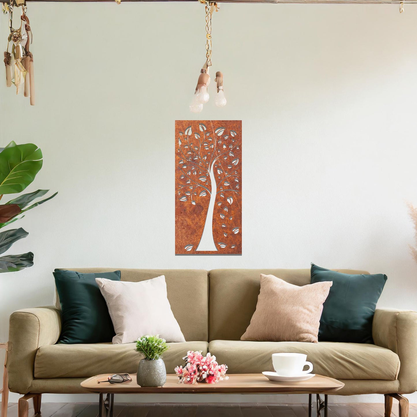Metal wall art featuring a tree with intricate branches and leaves, enclosed in a vertical rectangular frame. The artwork is displayed on a neutral wall within a modern office setting, complemented by a desk, chair, and indoor plants.