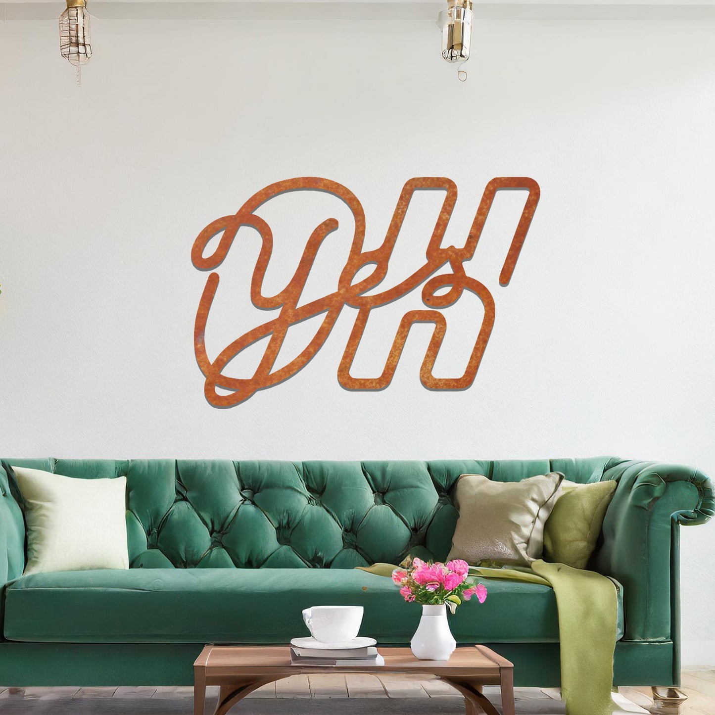 A contemporary metal wall art design featuring the bold, interwoven letters "Oh Yes" in a flowing, cursive style. The artwork is displayed on a neutral wall in a modern room setting.