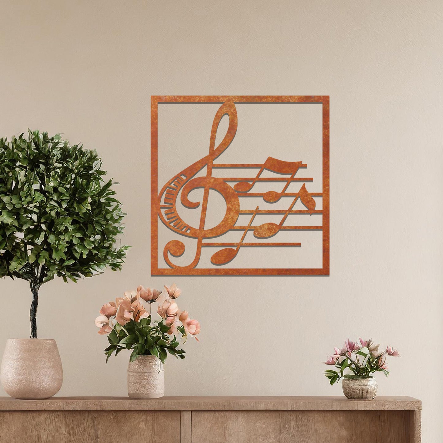 Metal wall art featuring a square design with a treble clef and musical notes on a staff, adding a harmonious and artistic touch to the space.