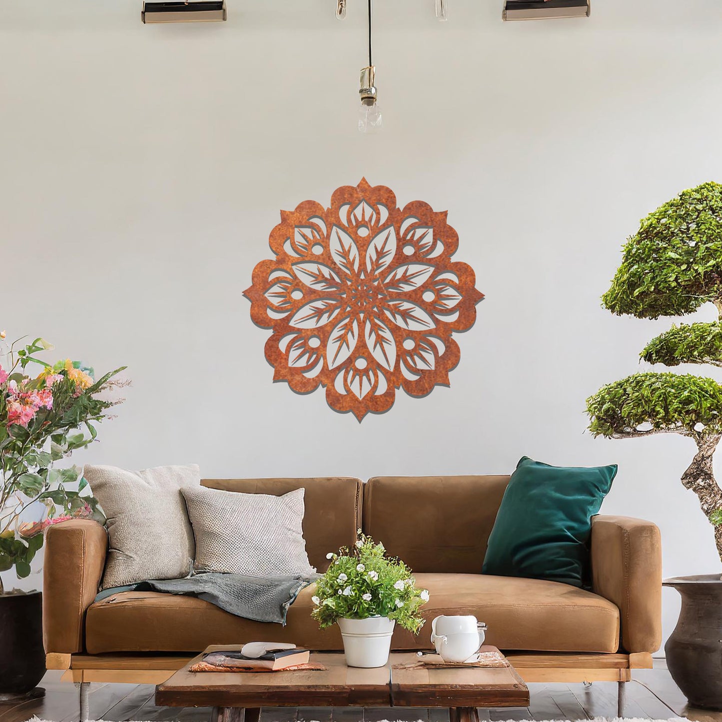 Metal wall art featuring an intricate mandala design with symmetrical floral patterns, mounted on a neutral wall within modern room decor. The detailed craftsmanship and balanced geometry create a striking focal point, enhancing the sophistication of the space.