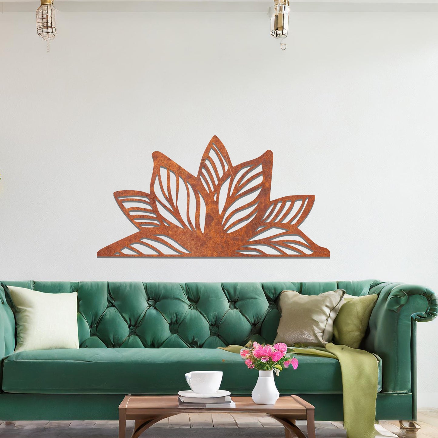 A beautifully intricate metal wall art design featuring a large, stylized lotus flower with detailed, flowing leaves. The art piece is placed on a neutral wall within a modern living room, adding elegance and natural beauty to the space.