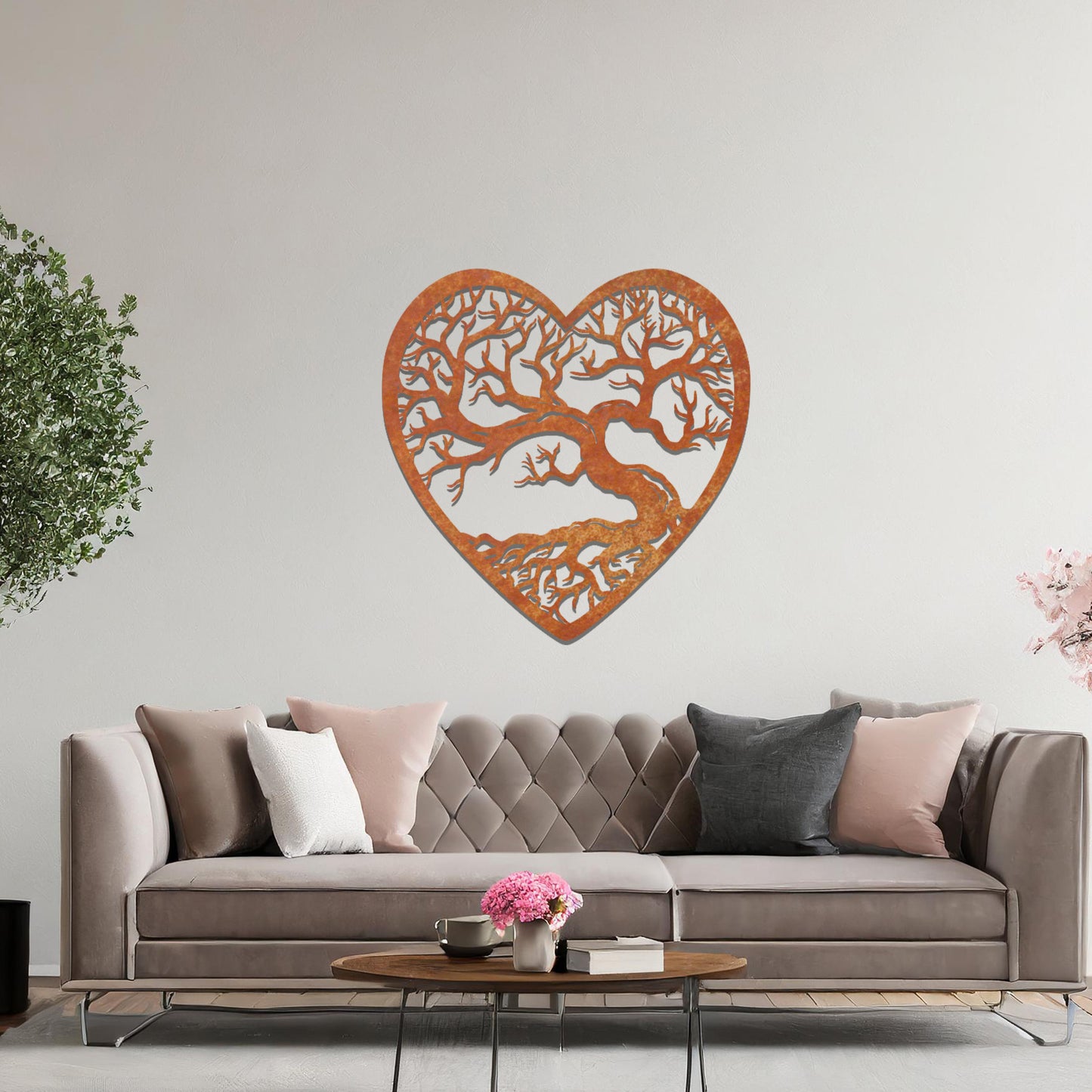 Metal wall art featuring a heart-shaped design with a detailed tree and intricate branching pattern, creating a striking and artistic focal point for the room.