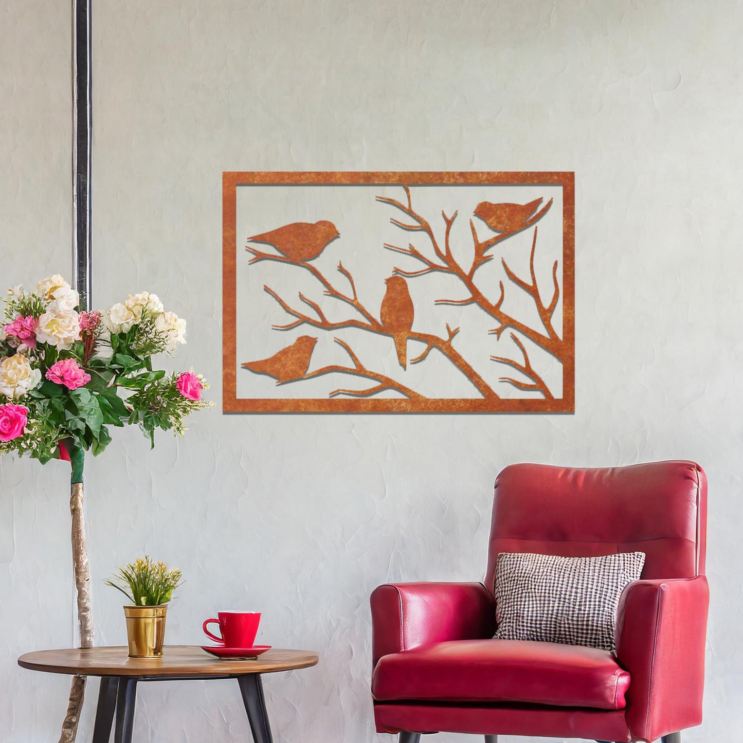 Metal wall art featuring a rectangular design of birds perched on bare branches, showcasing intricate silhouettes and adding a touch of nature-inspired charm to the interior space.
