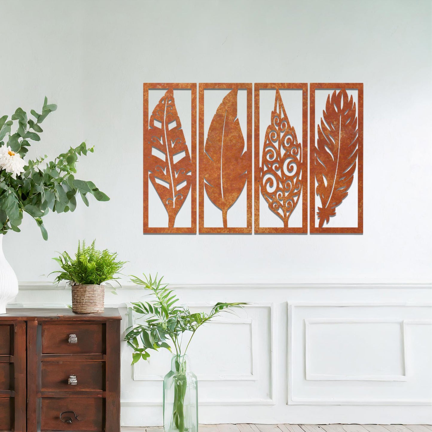 Metal wall art featuring five rectangular panels with detailed leaf designs, each panel showcasing a unique pattern. The art is mounted on a neutral wall within a modern office setting, adding a natural touch to the workspace decor.