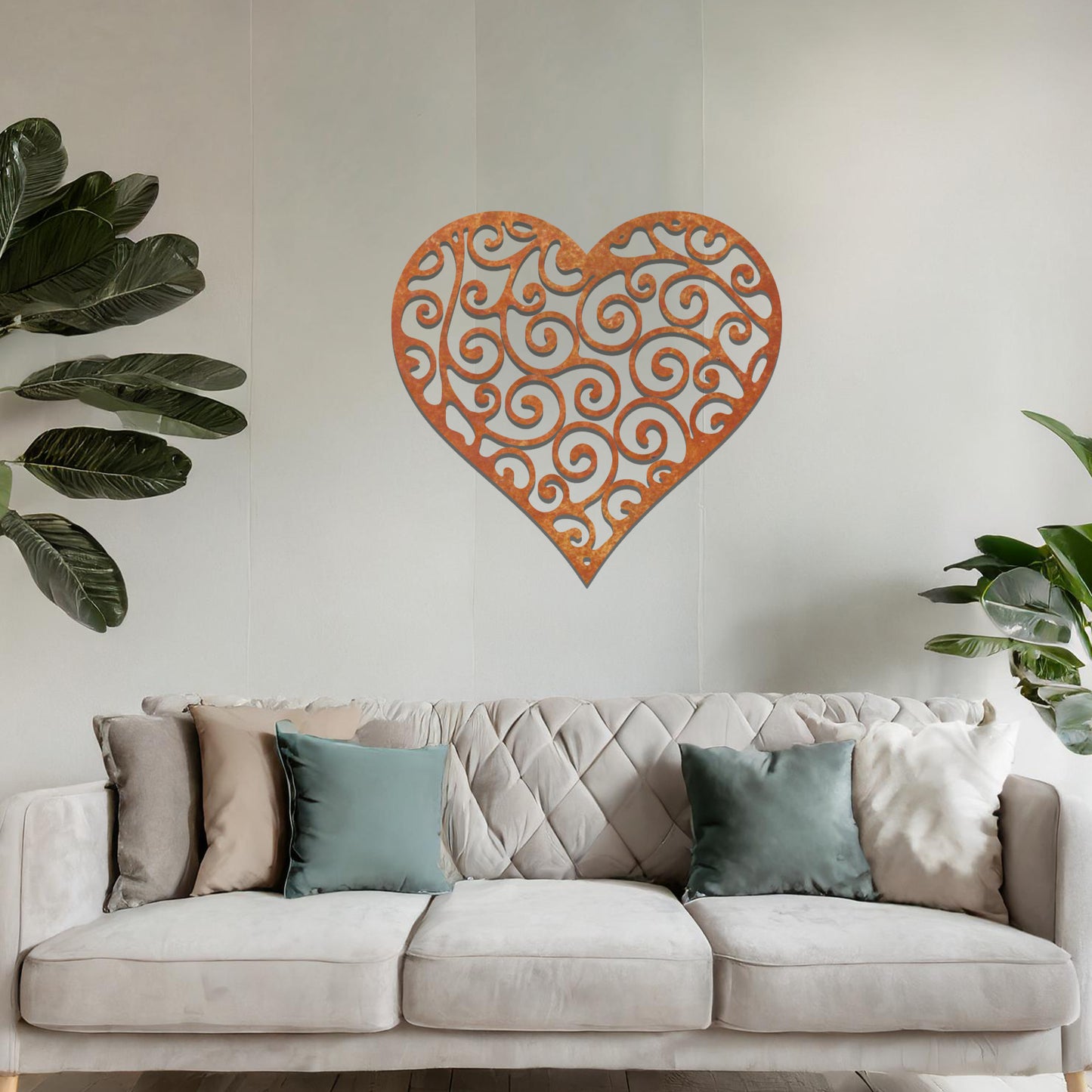 Metal wall art featuring a heart-shaped design with intricate swirling patterns, adding an elegant and romantic touch to the room’s decor.